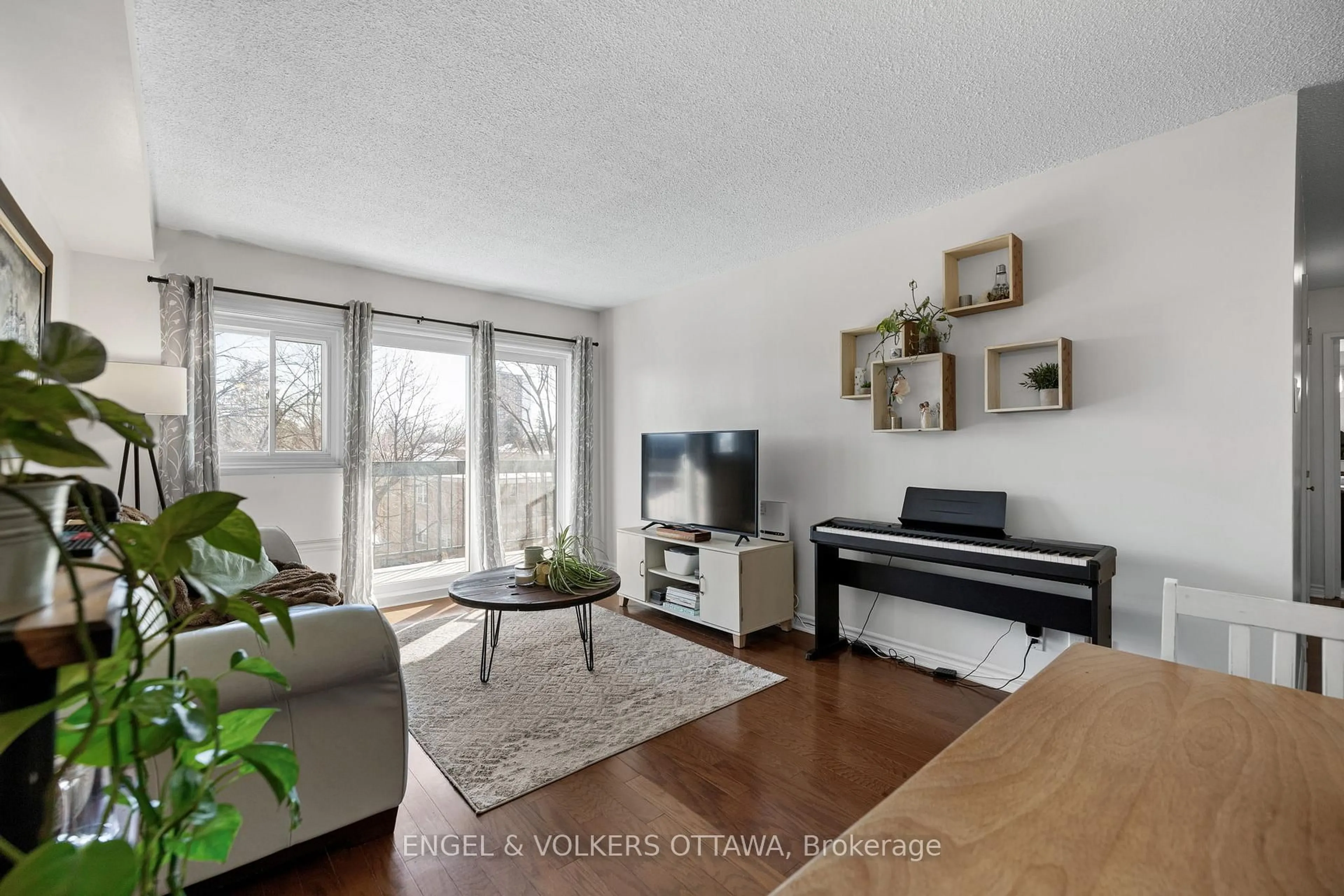 Living room with furniture, wood/laminate floor for 158A Mcarthur Ave #303, Ottawa Ontario K1L 7E7