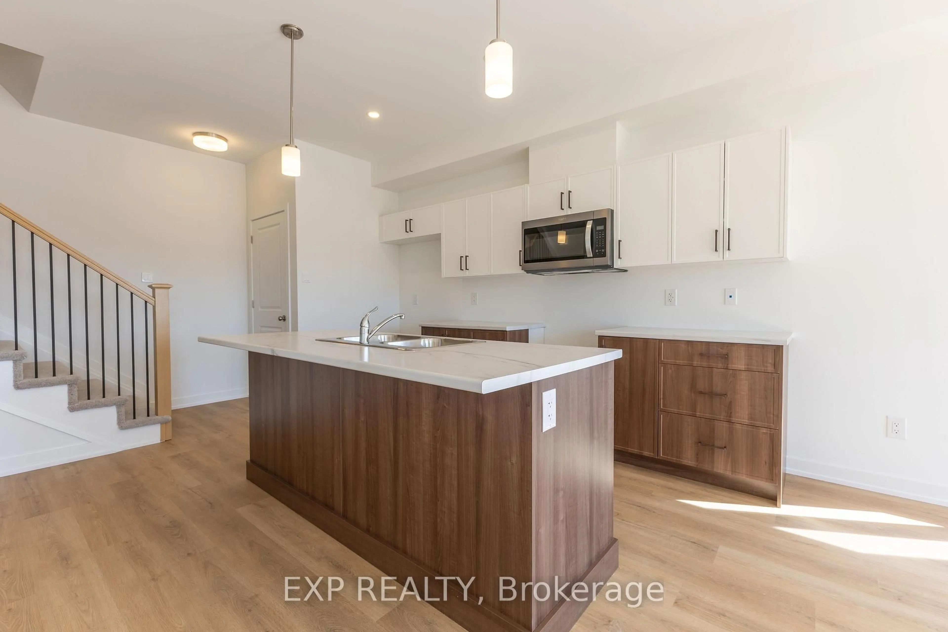 Open concept kitchen, wood/laminate floor for 1208 Cope Dr, Ottawa Ontario K2S 3C4