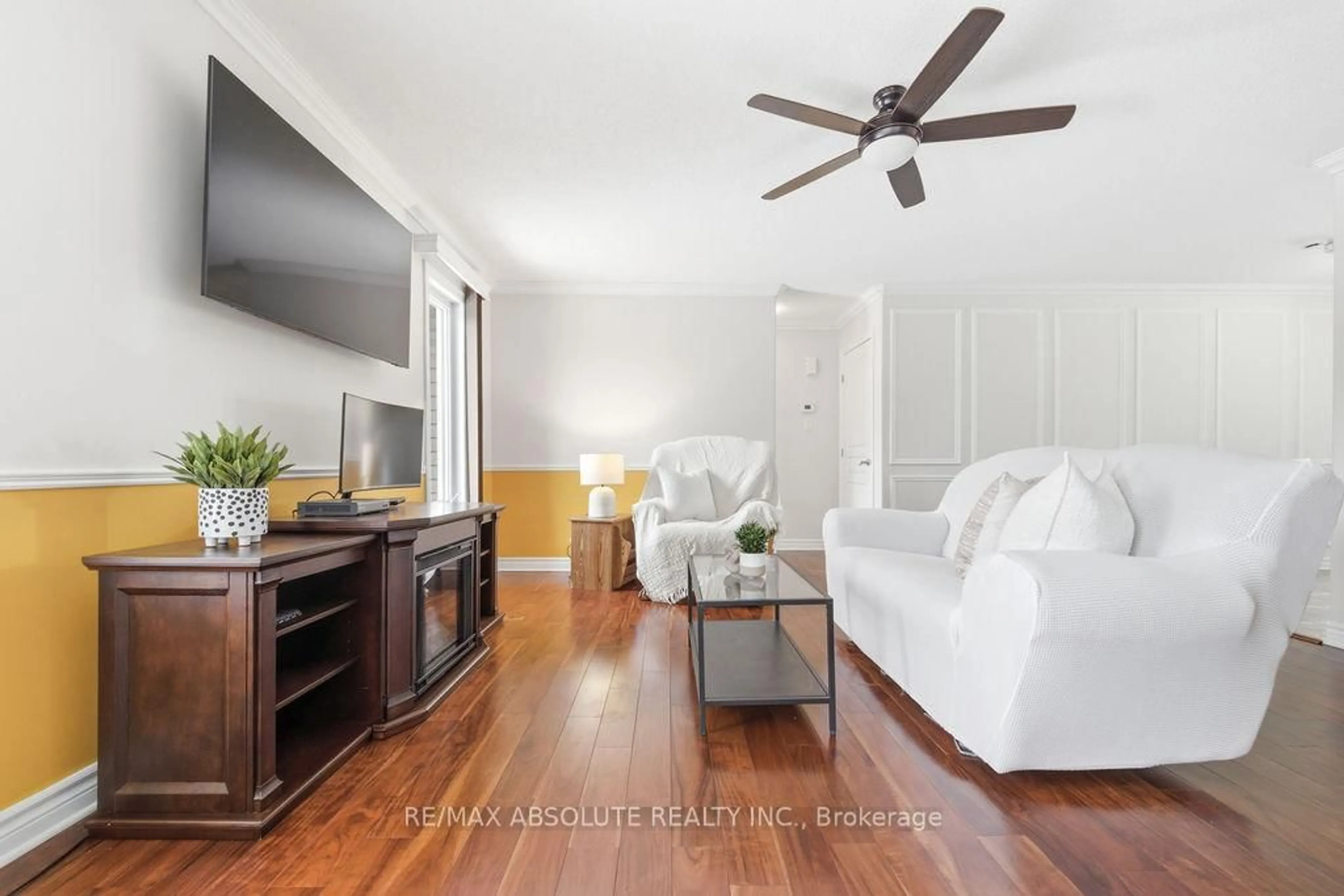 Living room with furniture, wood/laminate floor for 39 Bellwood Dr, Arnprior Ontario K7S 0H3