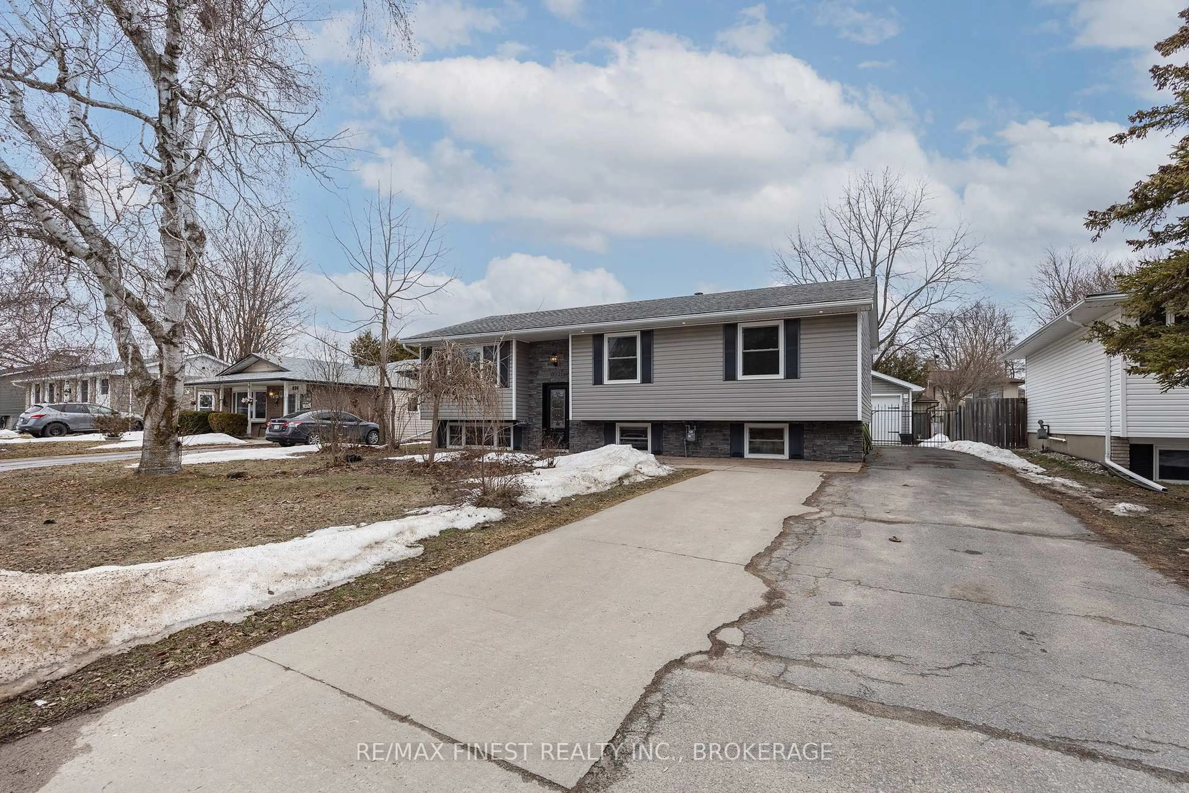 Home with vinyl exterior material, street for 892 Development Dr, Kingston Ontario K7M 5T1