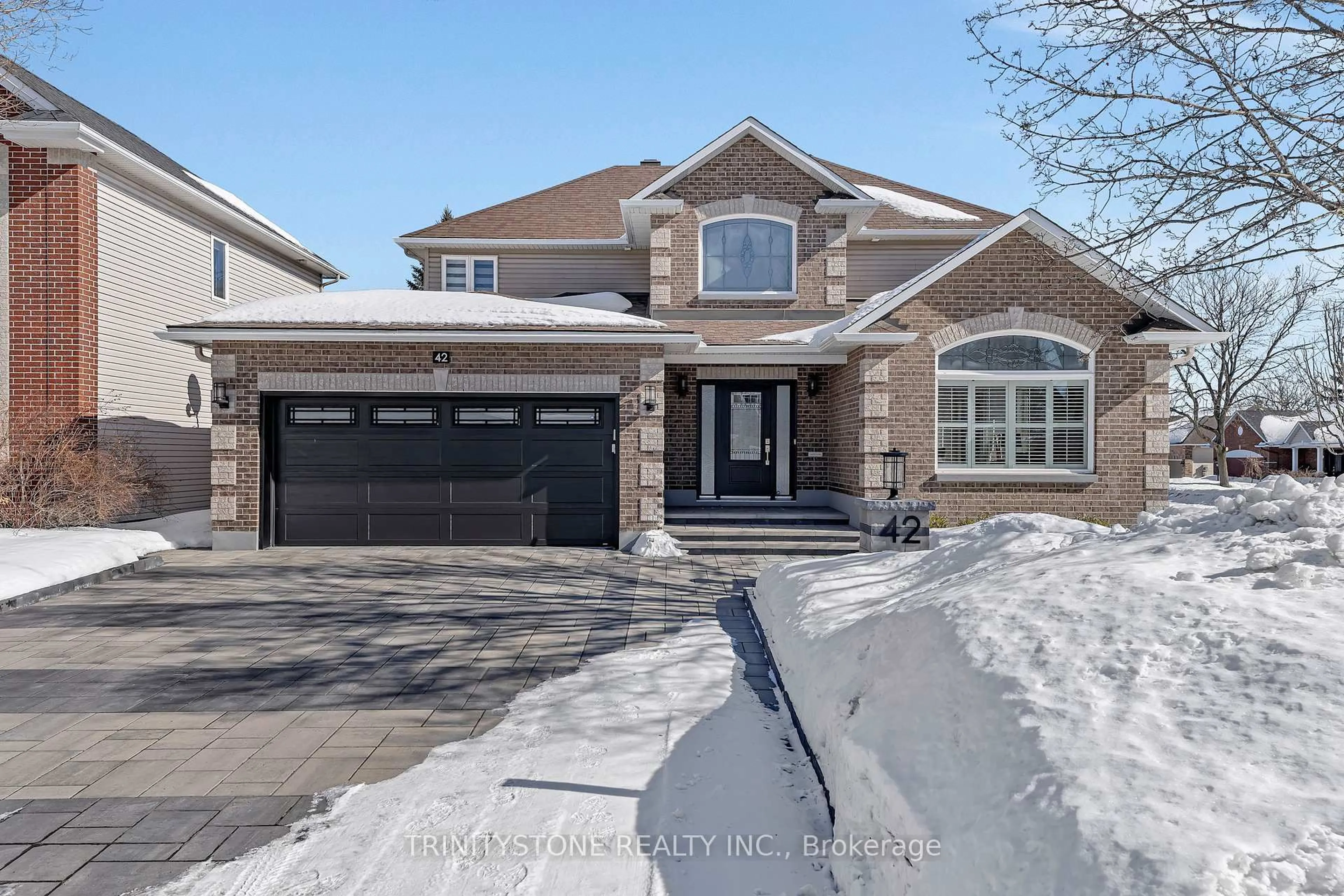 Home with brick exterior material, street for 42 Heritage Grove Cres, Ottawa Ontario K2S 1R2