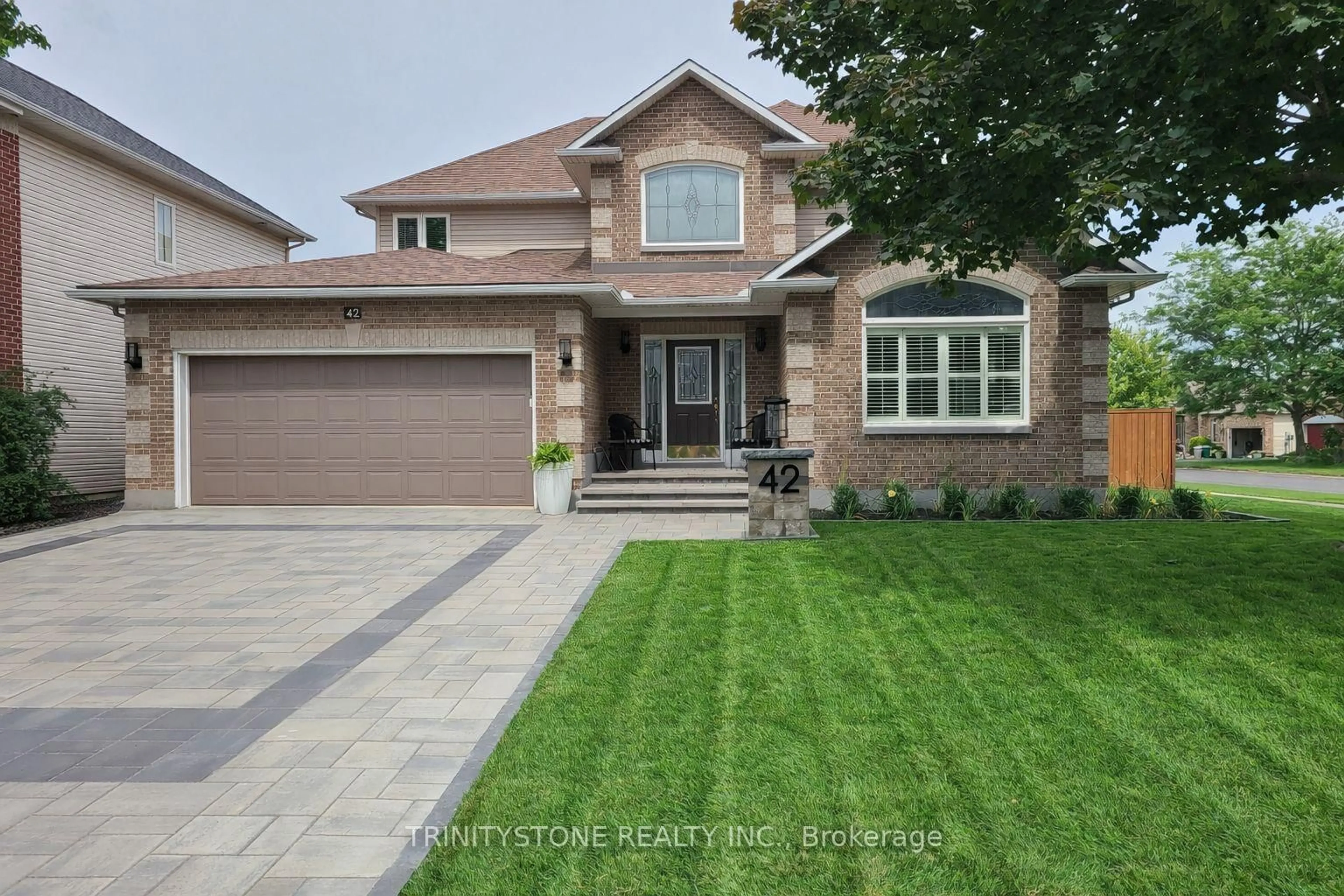 Home with brick exterior material, street for 42 Heritage Grove Cres, Ottawa Ontario K2S 1R2