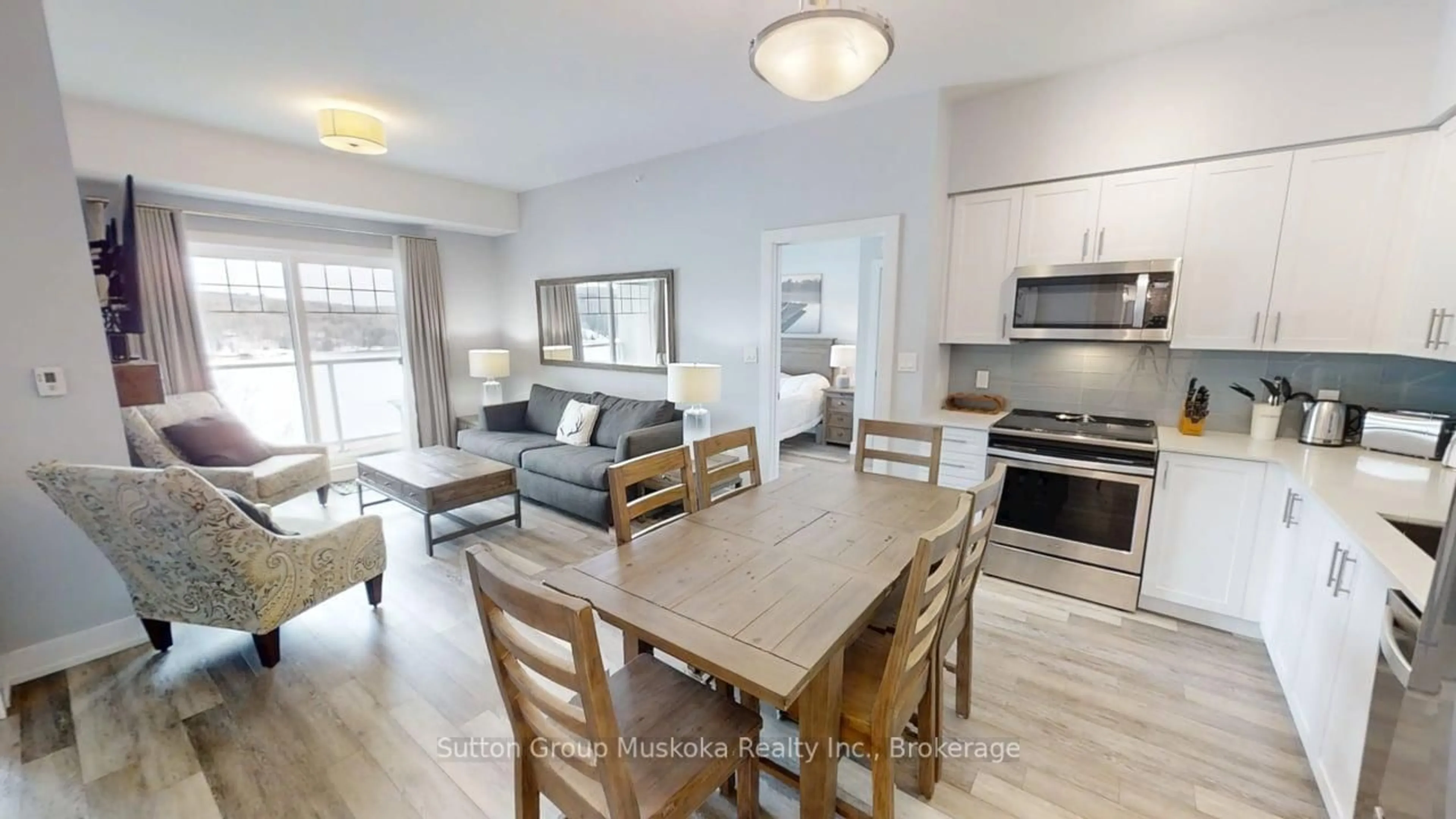 Open concept kitchen, wood/laminate floor for 25 Pen Lake Point Rd #423, Huntsville Ontario P1H 2E8