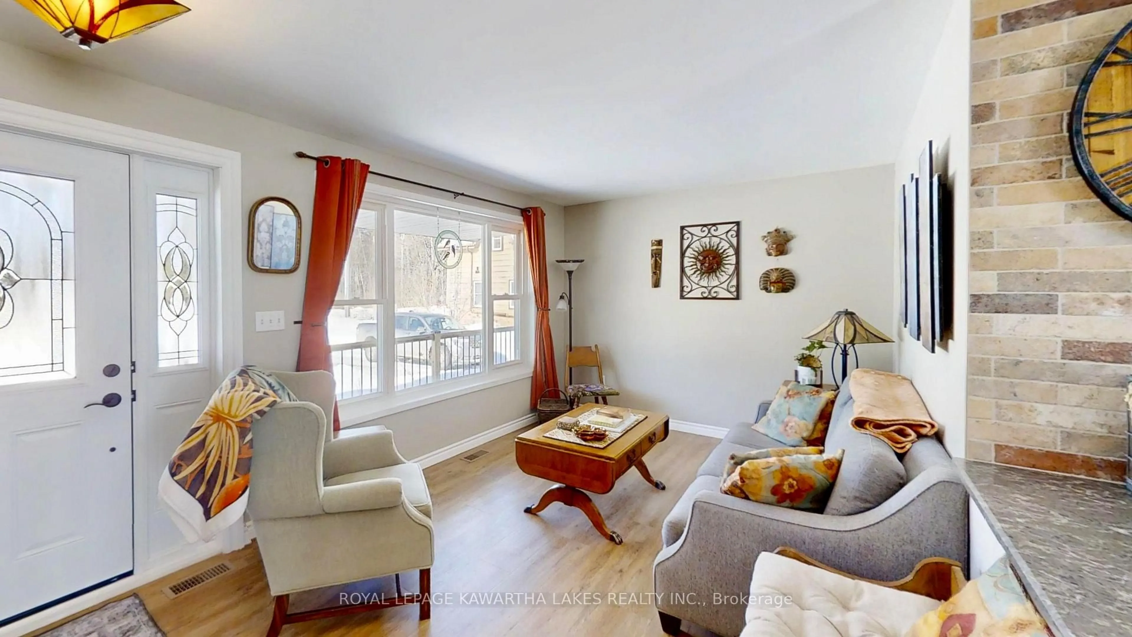 Living room with furniture, wood/laminate floor for 532 Fenel Rd, Kawartha Lakes Ontario K0M 2T0