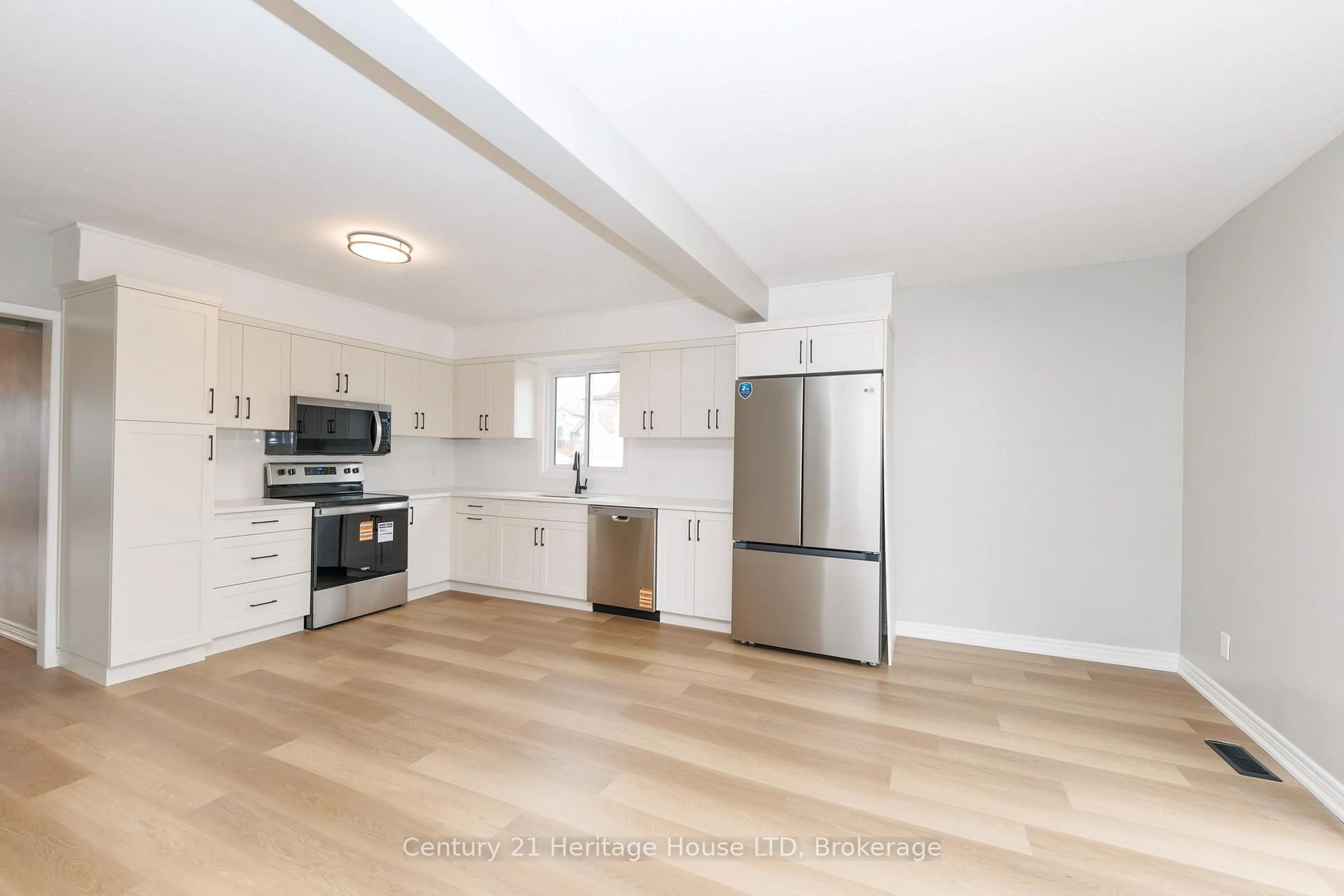 Open concept kitchen, wood/laminate floor for 64 Patricia St, Thorold Ontario L2V 3W1