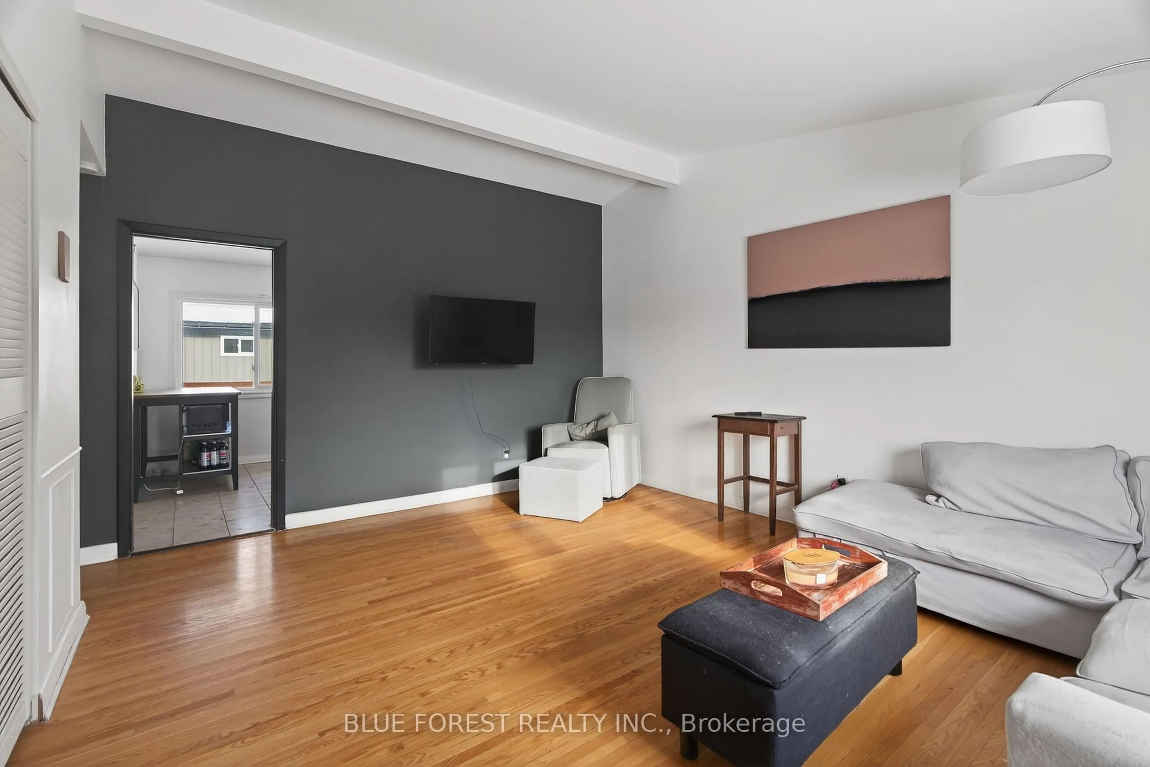 Living room with furniture, wood/laminate floor for 254 Burlington St, London South Ontario N5Z 3W5