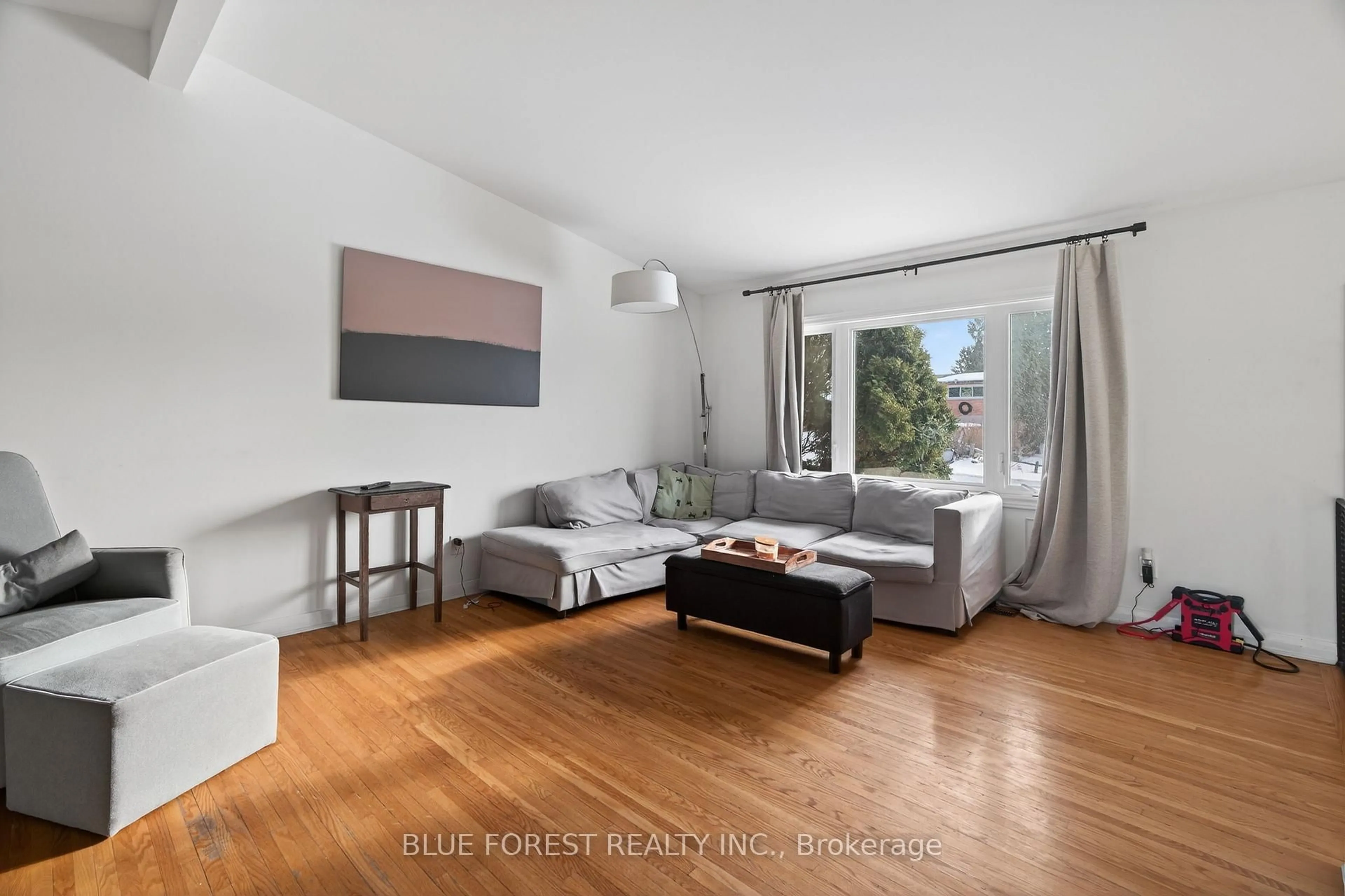 Living room with furniture, wood/laminate floor for 254 Burlington St, London South Ontario N5Z 3W5