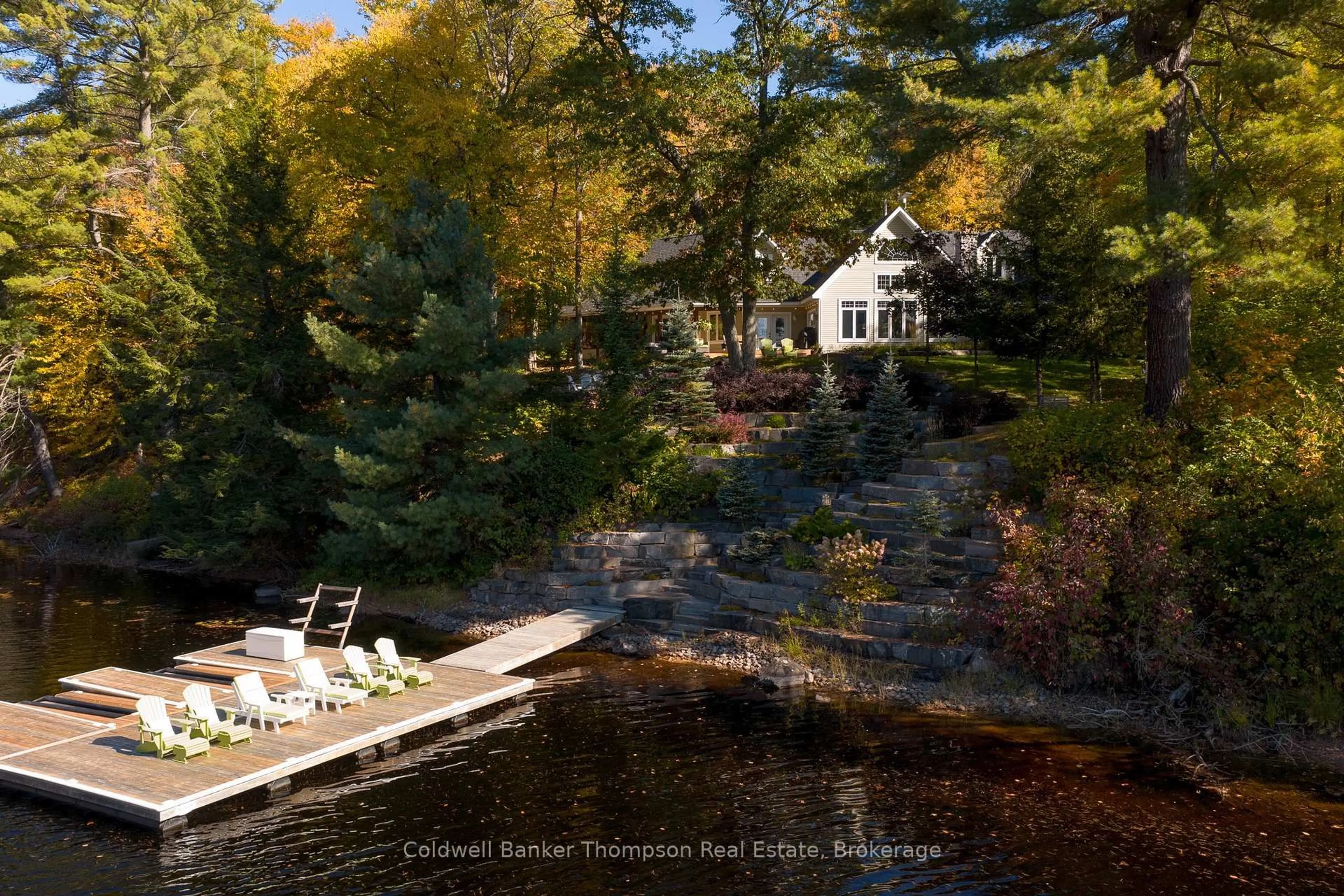 A pic from outside/outdoor area/front of a property/back of a property/a pic from drone, water/lake/river/ocean view for 54 Hoodstown Shores Rd, Huntsville Ontario P1H 2J2