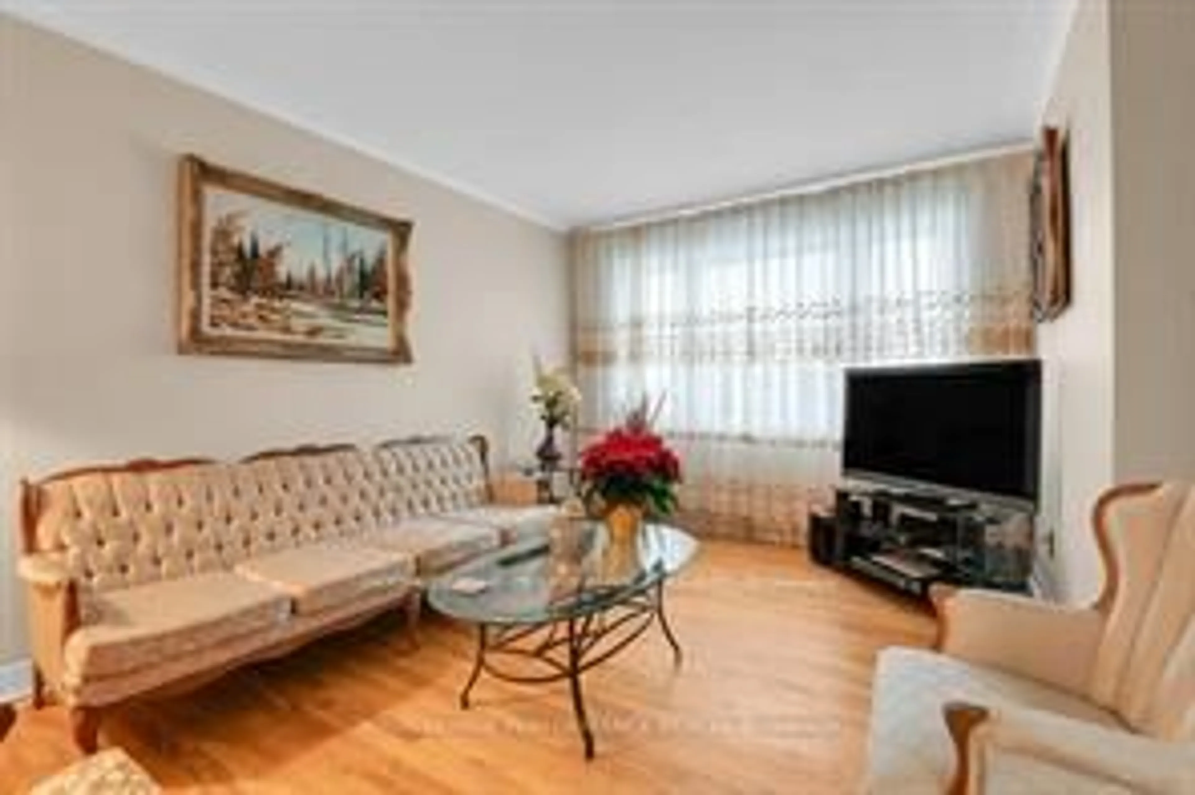 Living room with furniture, wood/laminate floor for 456 Blake Blvd, Ottawa Ontario K1K 1B1