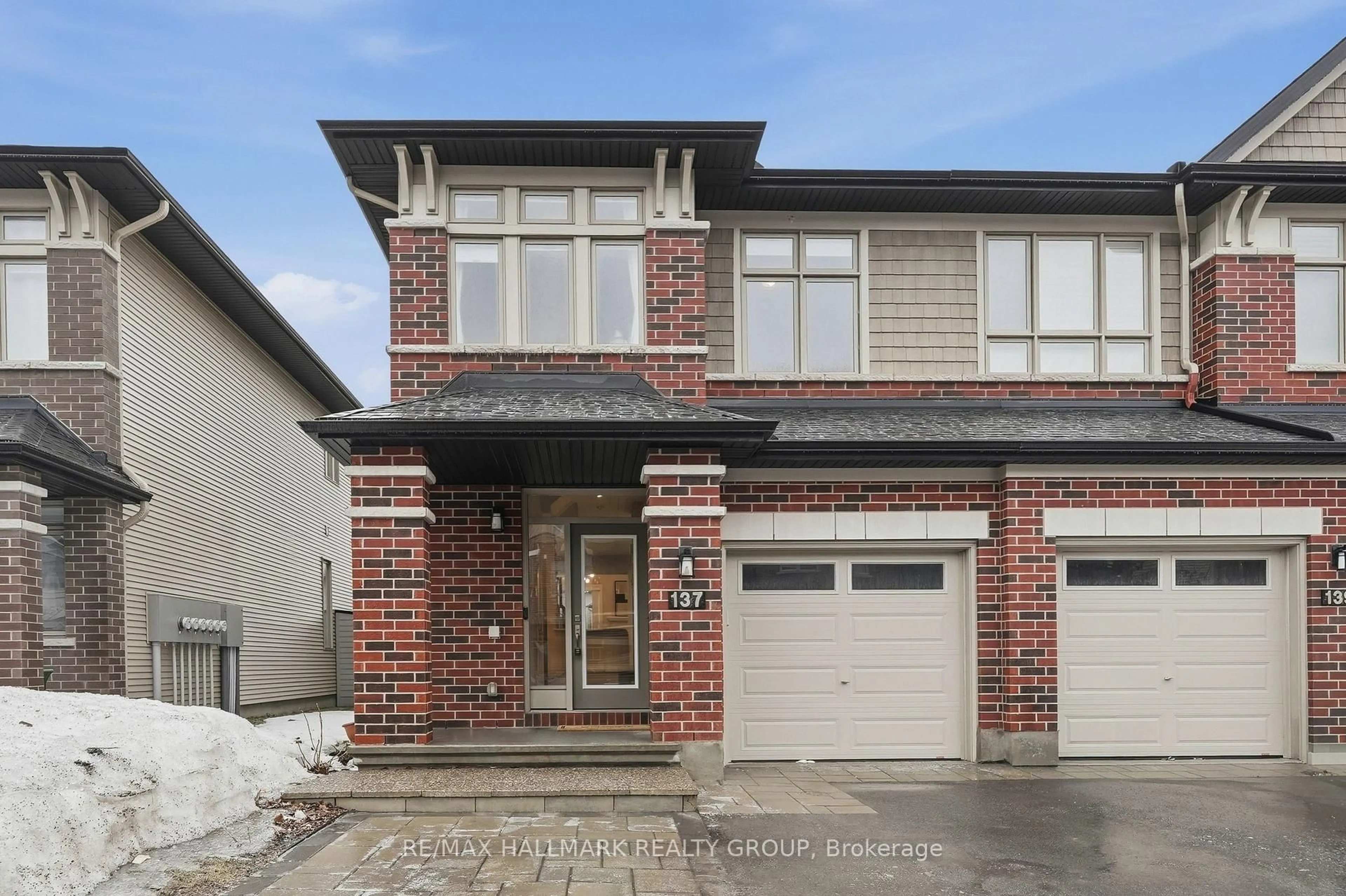 Home with brick exterior material, street for 137 Wild Calla Way, Ottawa Ontario K1W 0K4