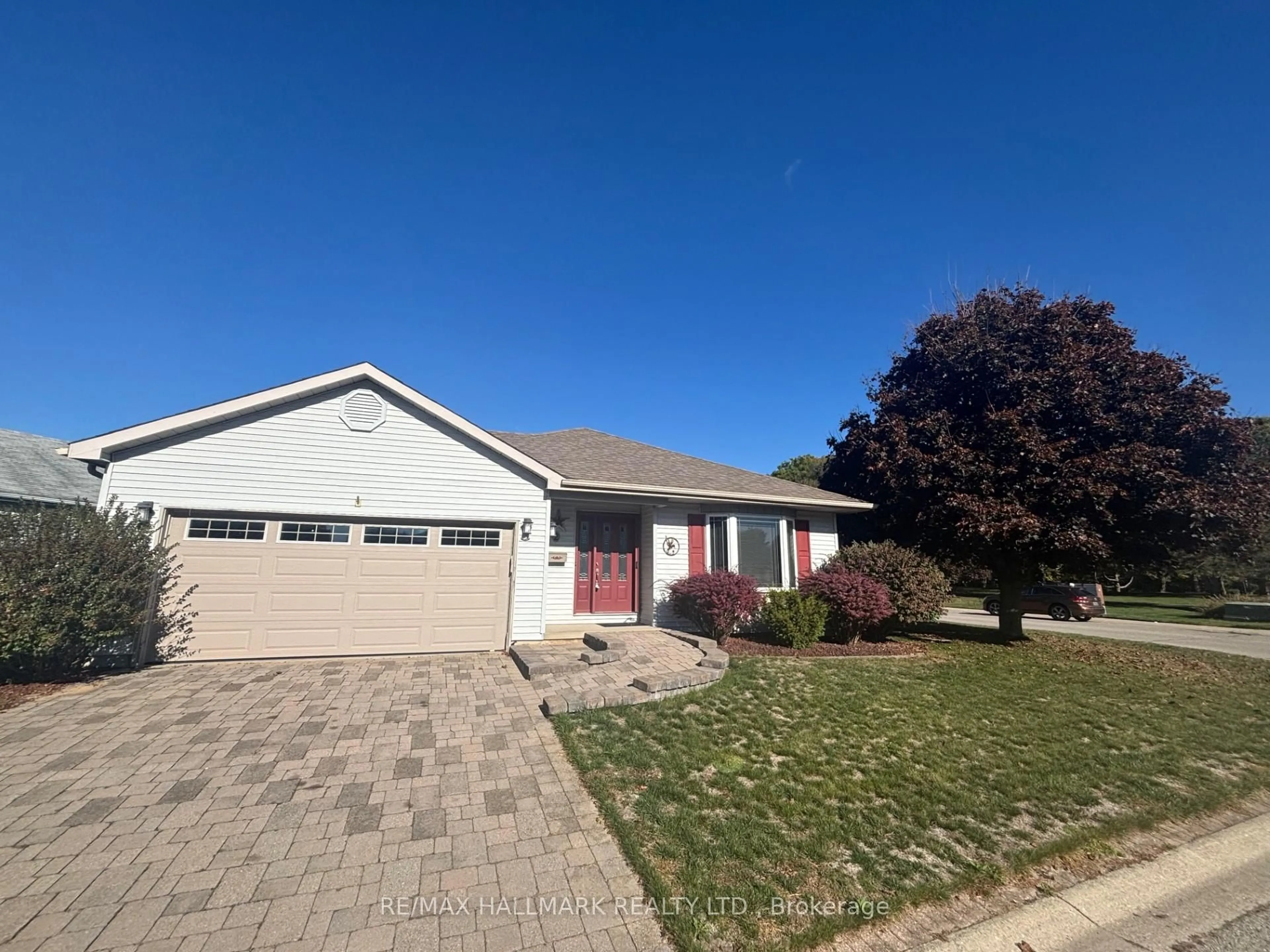 Home with vinyl exterior material, street for 2 Brasher Dr, Tillsonburg Ontario N4G 5T2