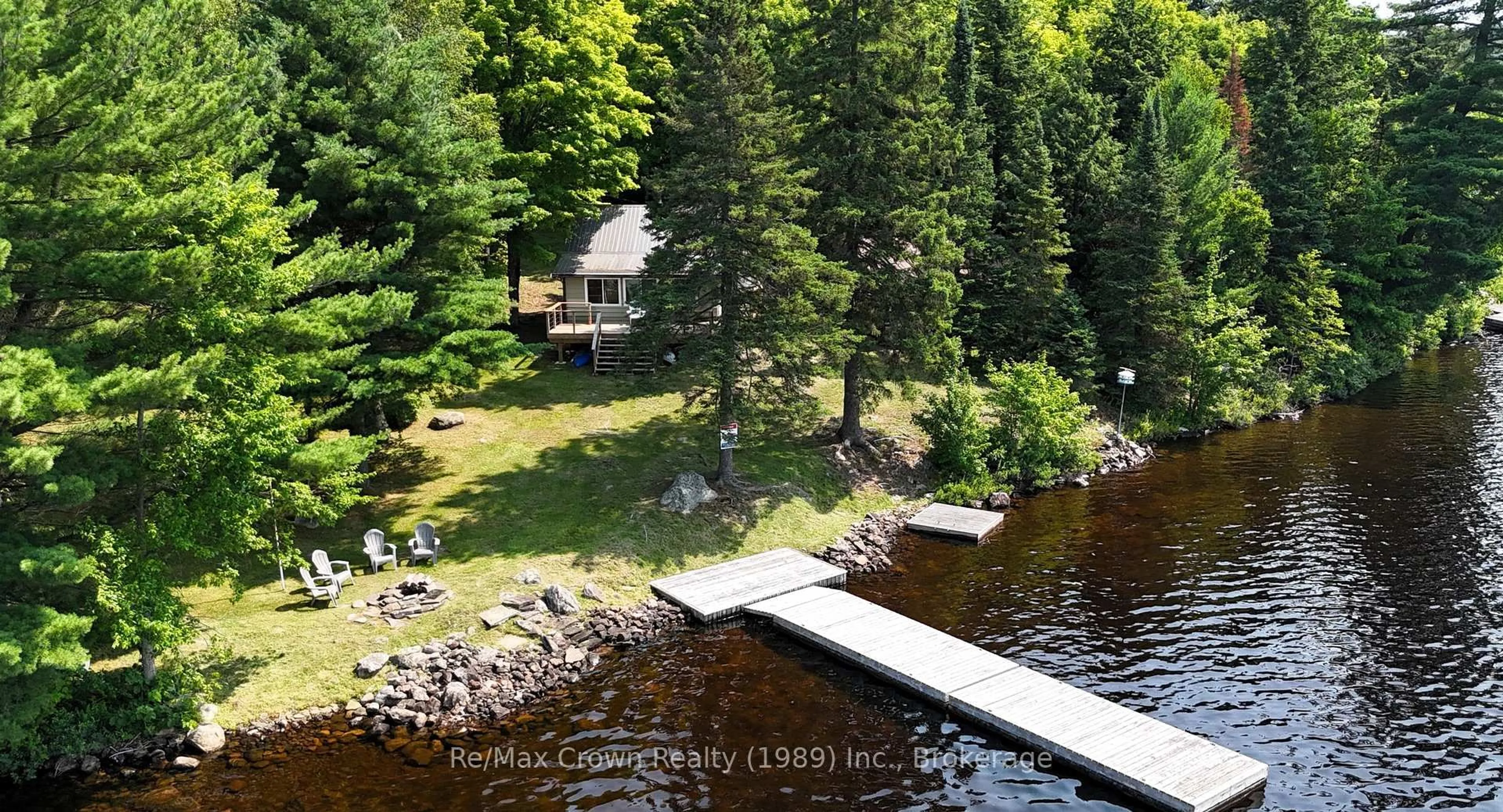 A pic from outside/outdoor area/front of a property/back of a property/a pic from drone, water/lake/river/ocean view for 131 Lee Lane, Parry Sound Remote Area Ontario P0H 1S0