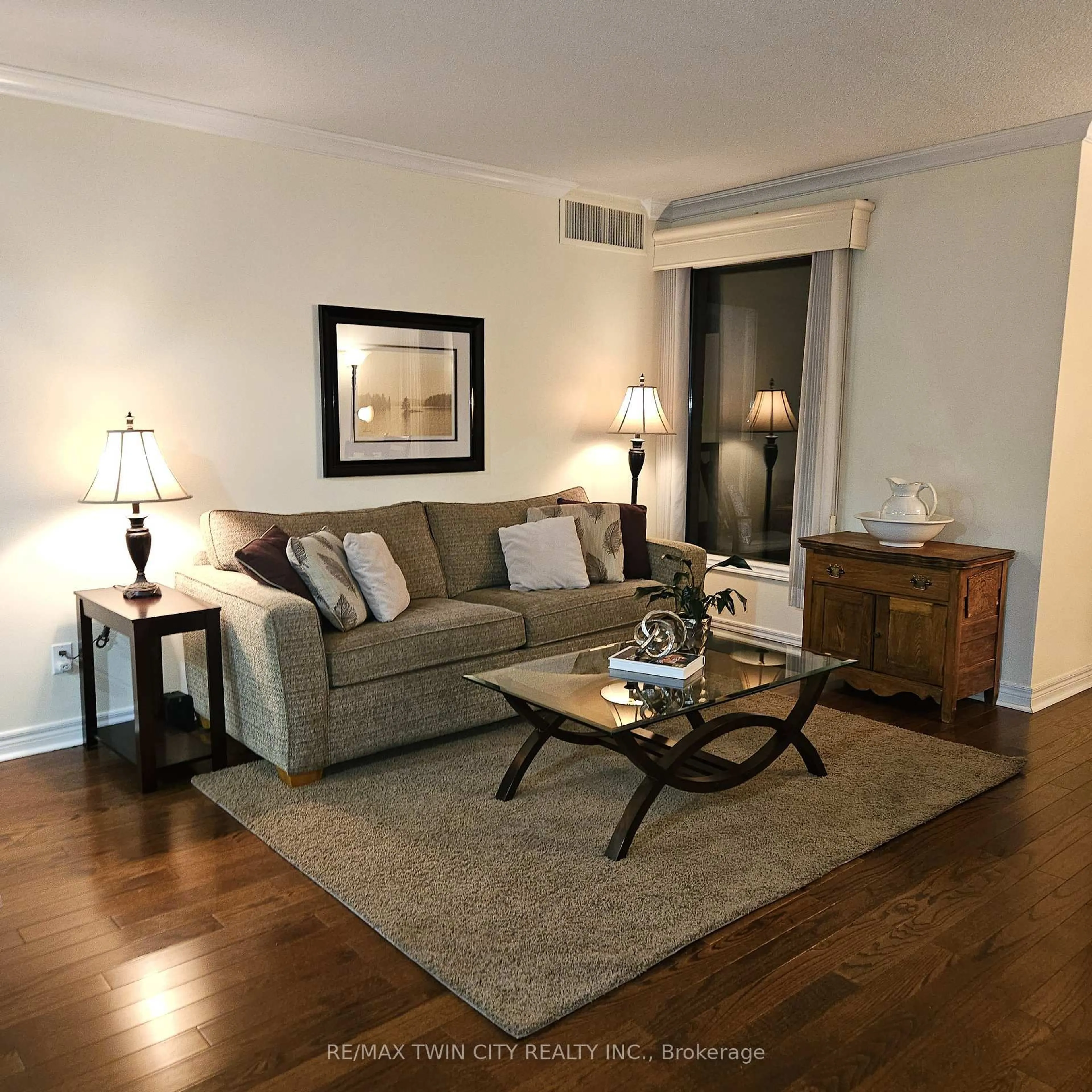 Living room with furniture, wood/laminate floor for 260 Sheldon Ave #609, Kitchener Ontario N2H 6P2