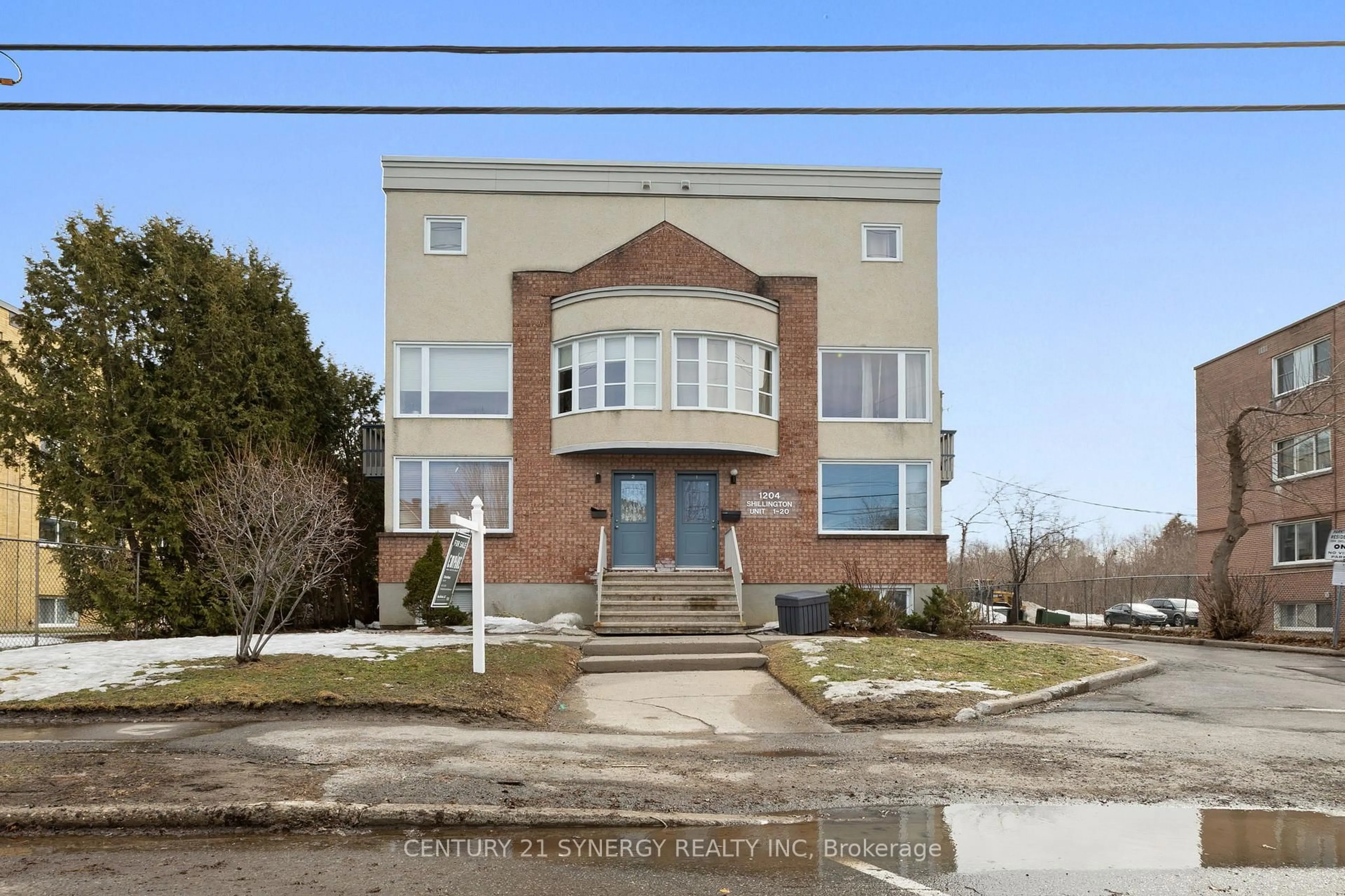 Home with brick exterior material, street for 1204 Shillington Ave #8, Ottawa Ontario K1Z 7Z4