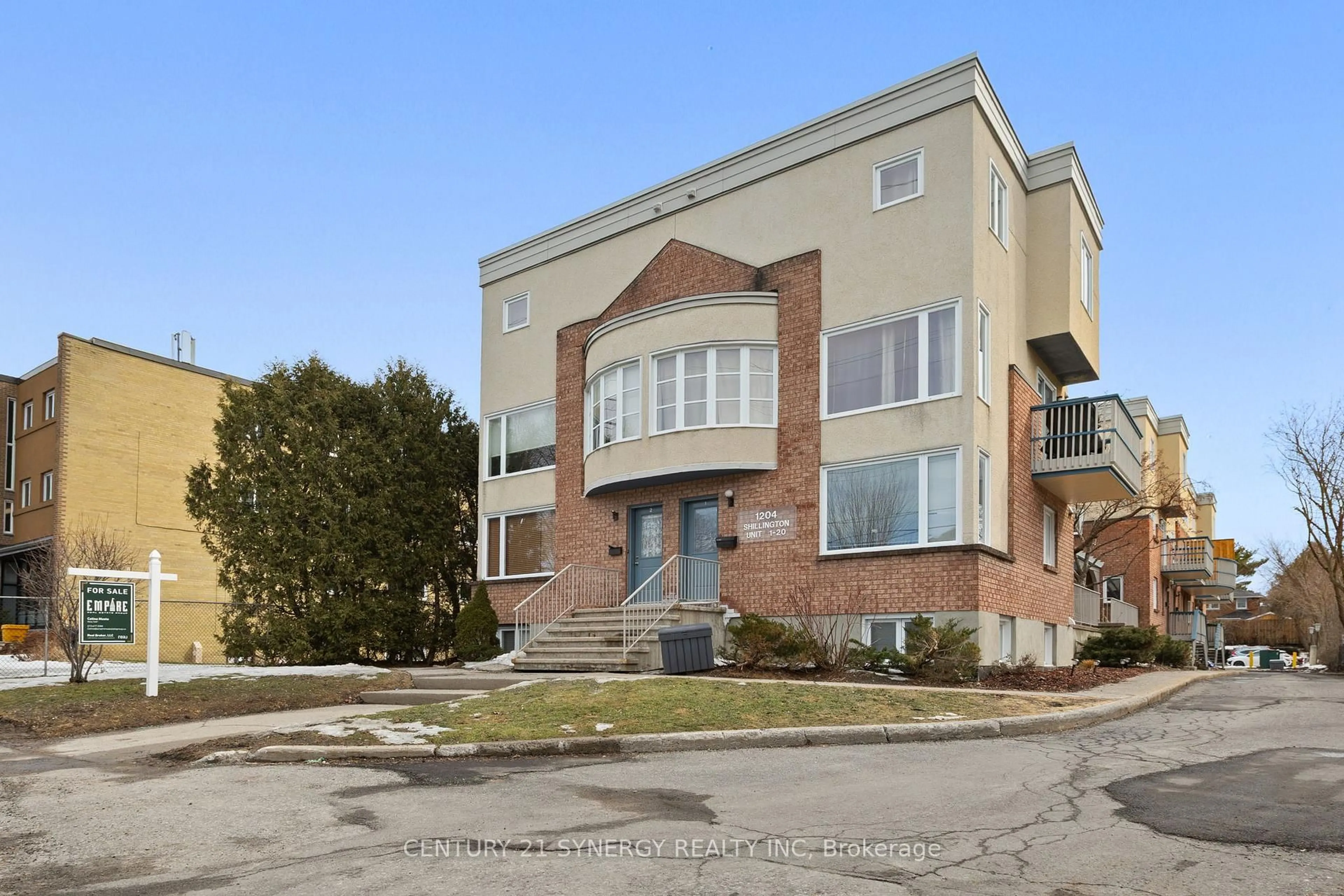 Home with brick exterior material, street for 1204 Shillington Ave #8, Ottawa Ontario K1Z 7Z4