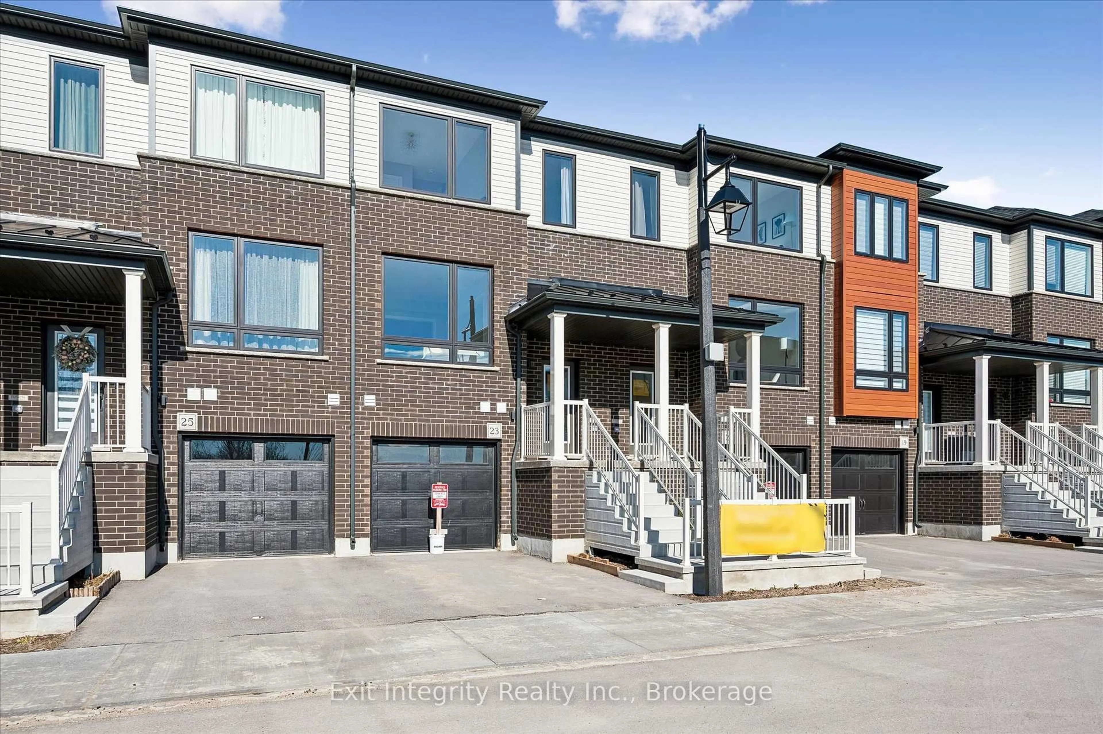 Home with brick exterior material, street for 23 Sora Lane, Guelph Ontario N1E 0T4