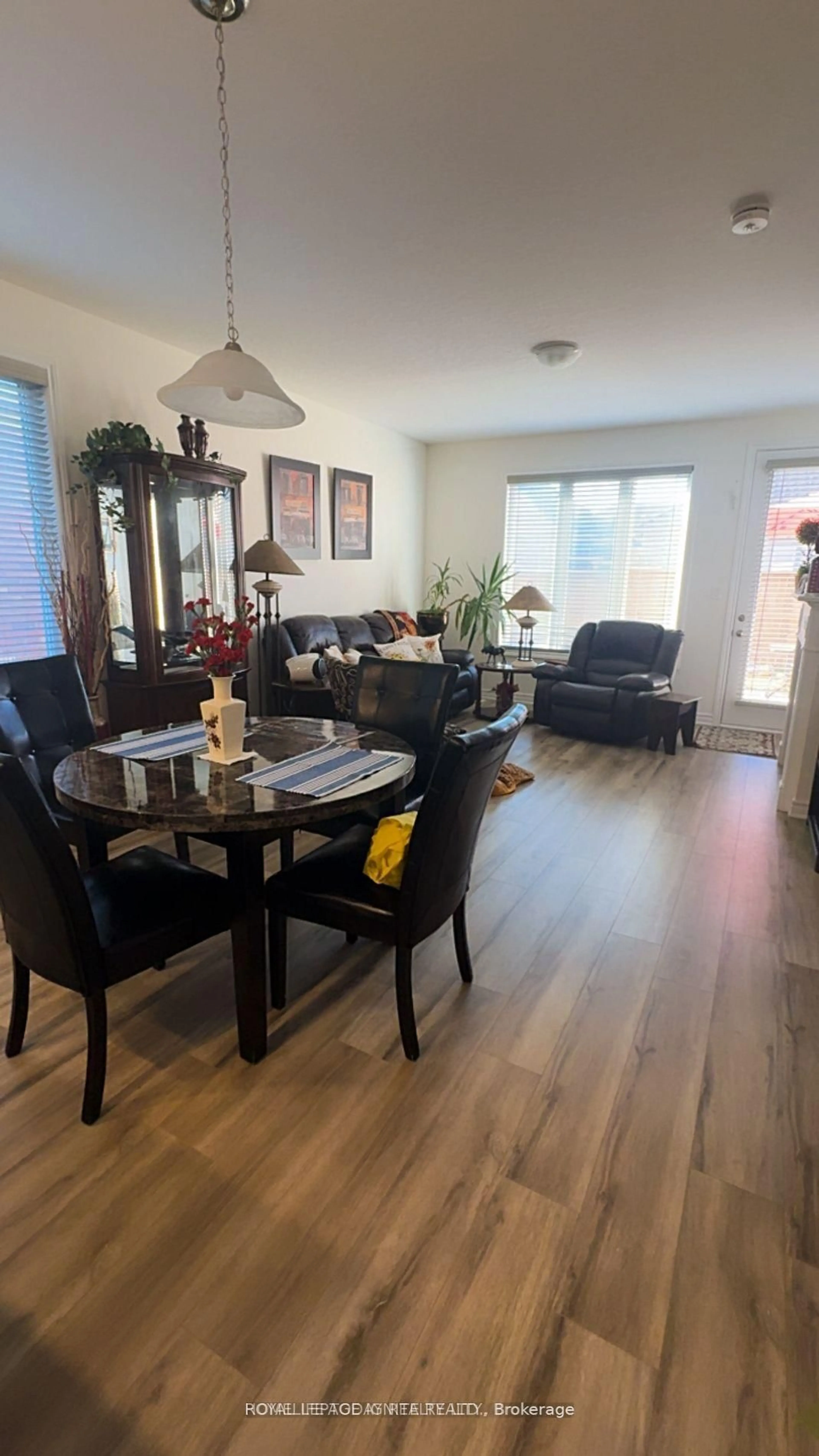 Living room with furniture, wood/laminate floor for 27 Seaton Cres, Tillsonburg Ontario N4G 0J8