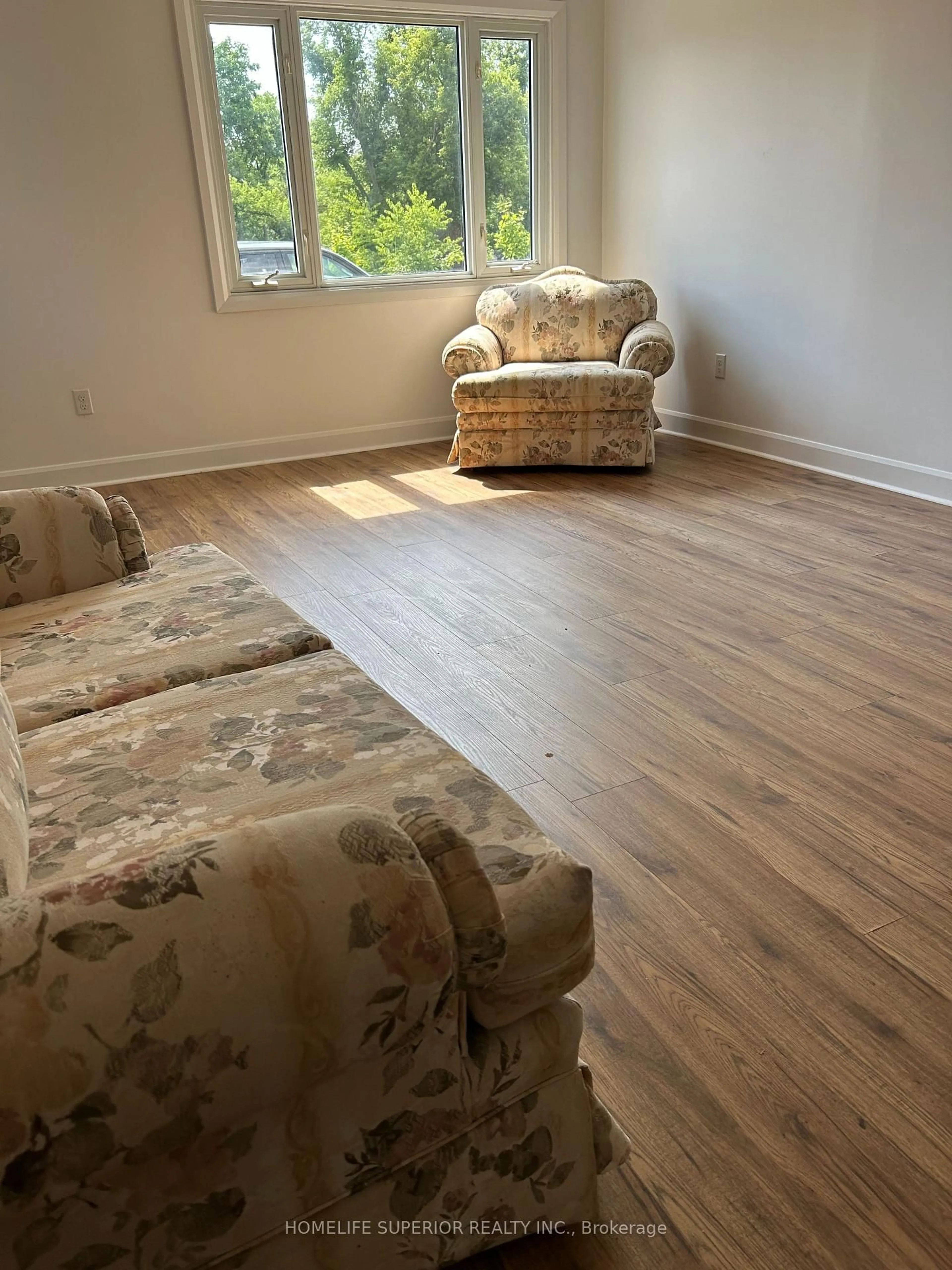 Living room with furniture, wood/laminate floor for 10 Main St, Limoges Ontario K0K 2M0