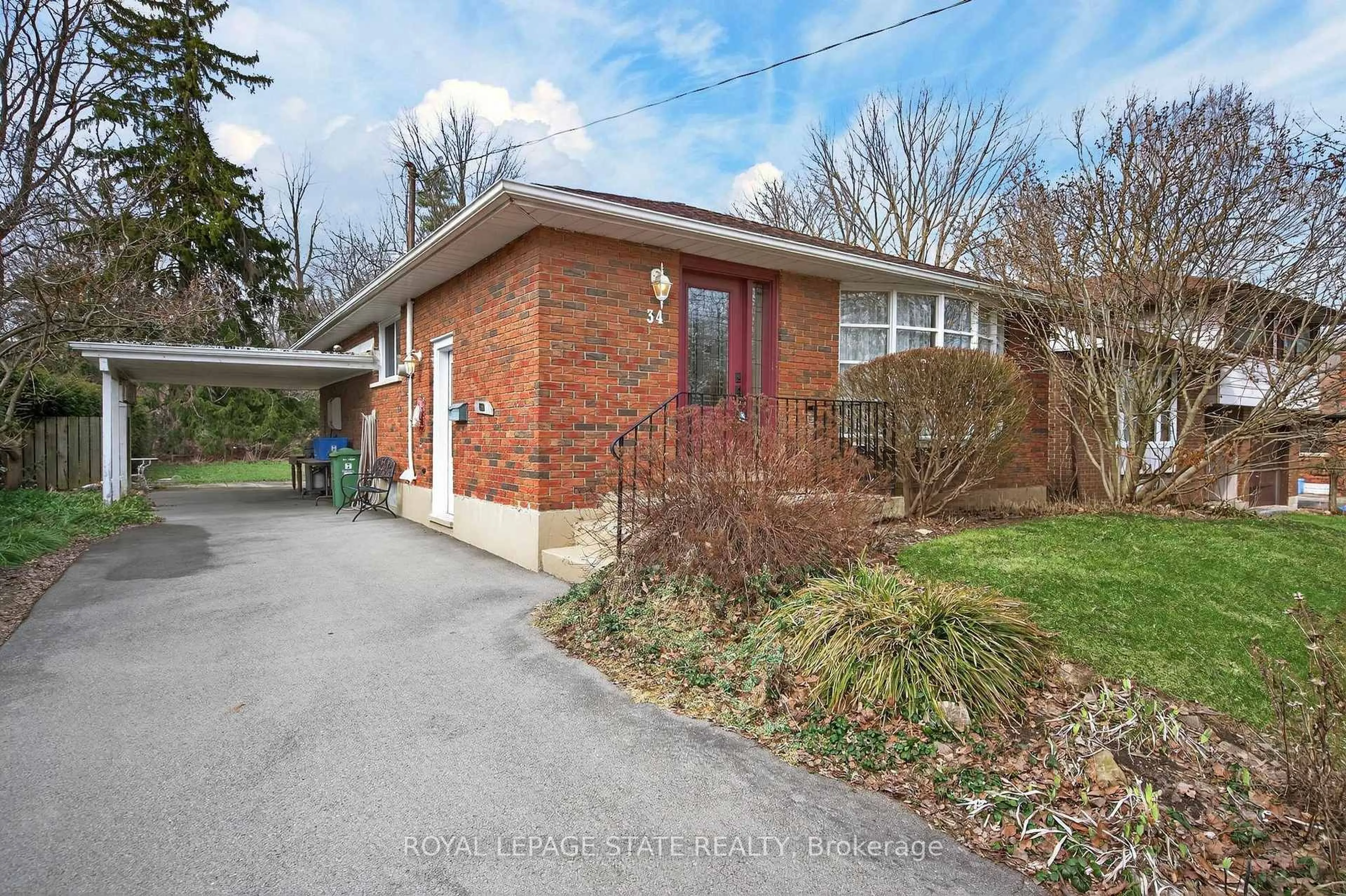 Home with brick exterior material, street for 34 Helen St, Hamilton Ontario L9H 1N3