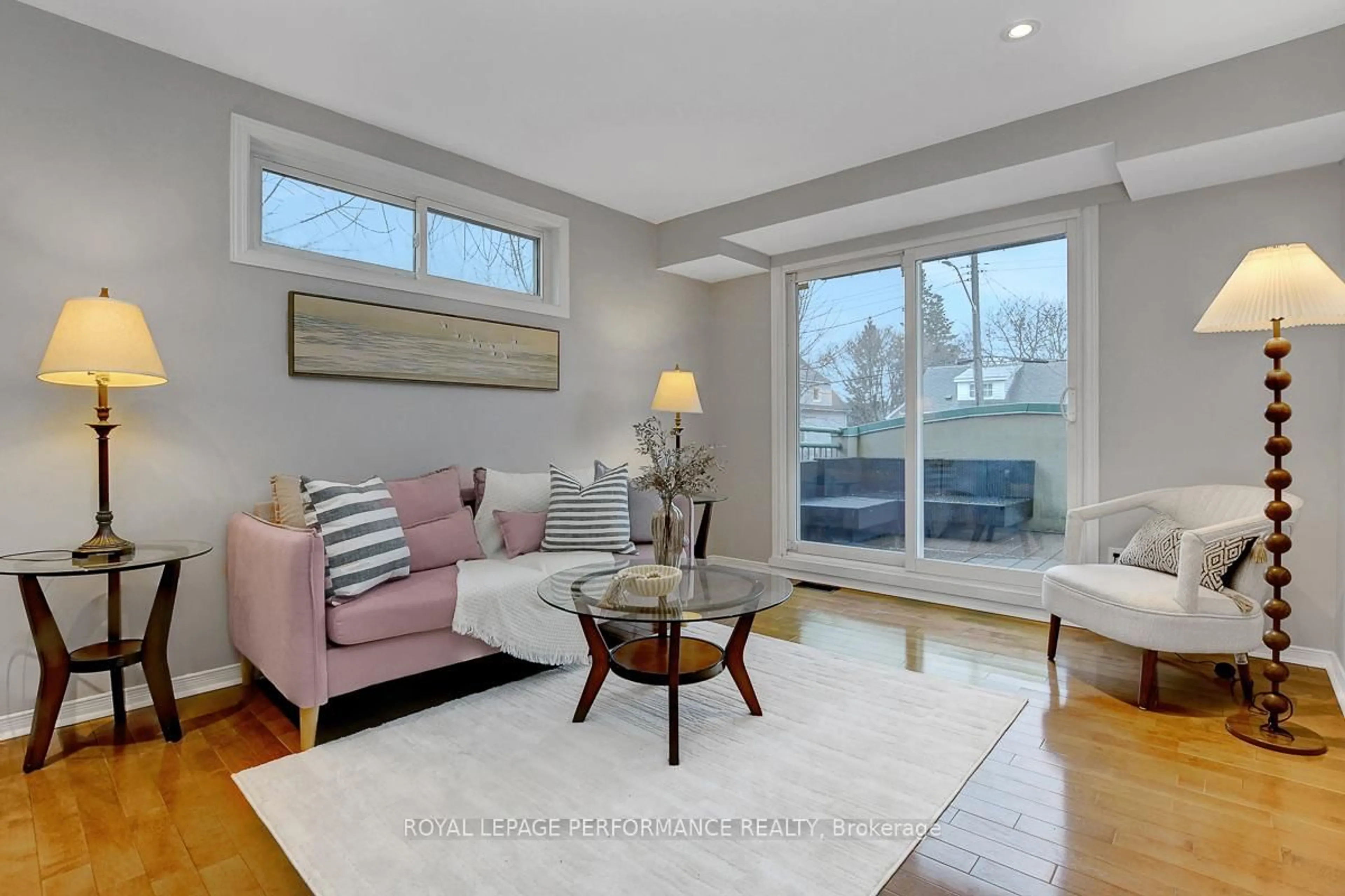 Living room with furniture, wood/laminate floor for 19 Columbus Ave, Ottawa Ontario K1K 1R2