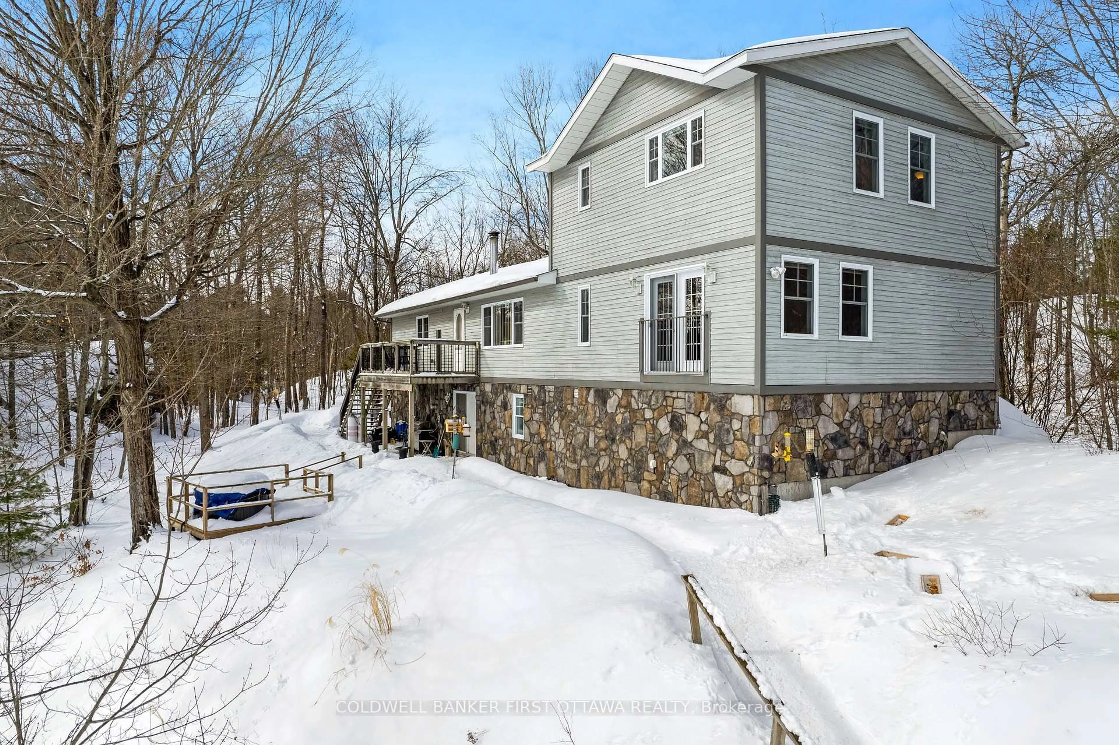 A pic from outside/outdoor area/front of a property/back of a property/a pic from drone, unknown for 166 O'Brien Lake Lane #14b, Maberly Ontario K0H 2B0