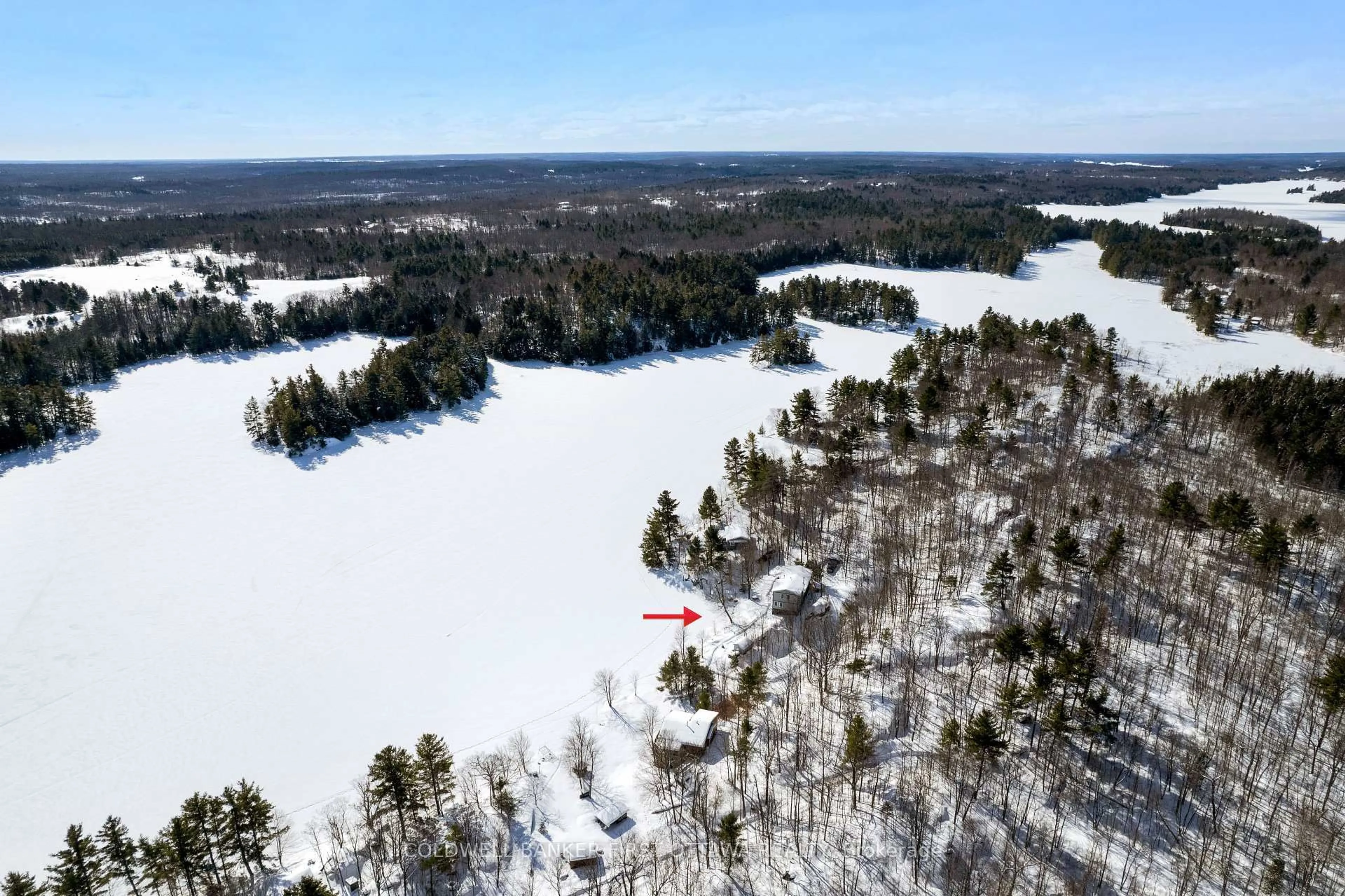 A pic from outside/outdoor area/front of a property/back of a property/a pic from drone, water/lake/river/ocean view for 166 O'Brien Lake Lane #14b, Maberly Ontario K0H 2B0