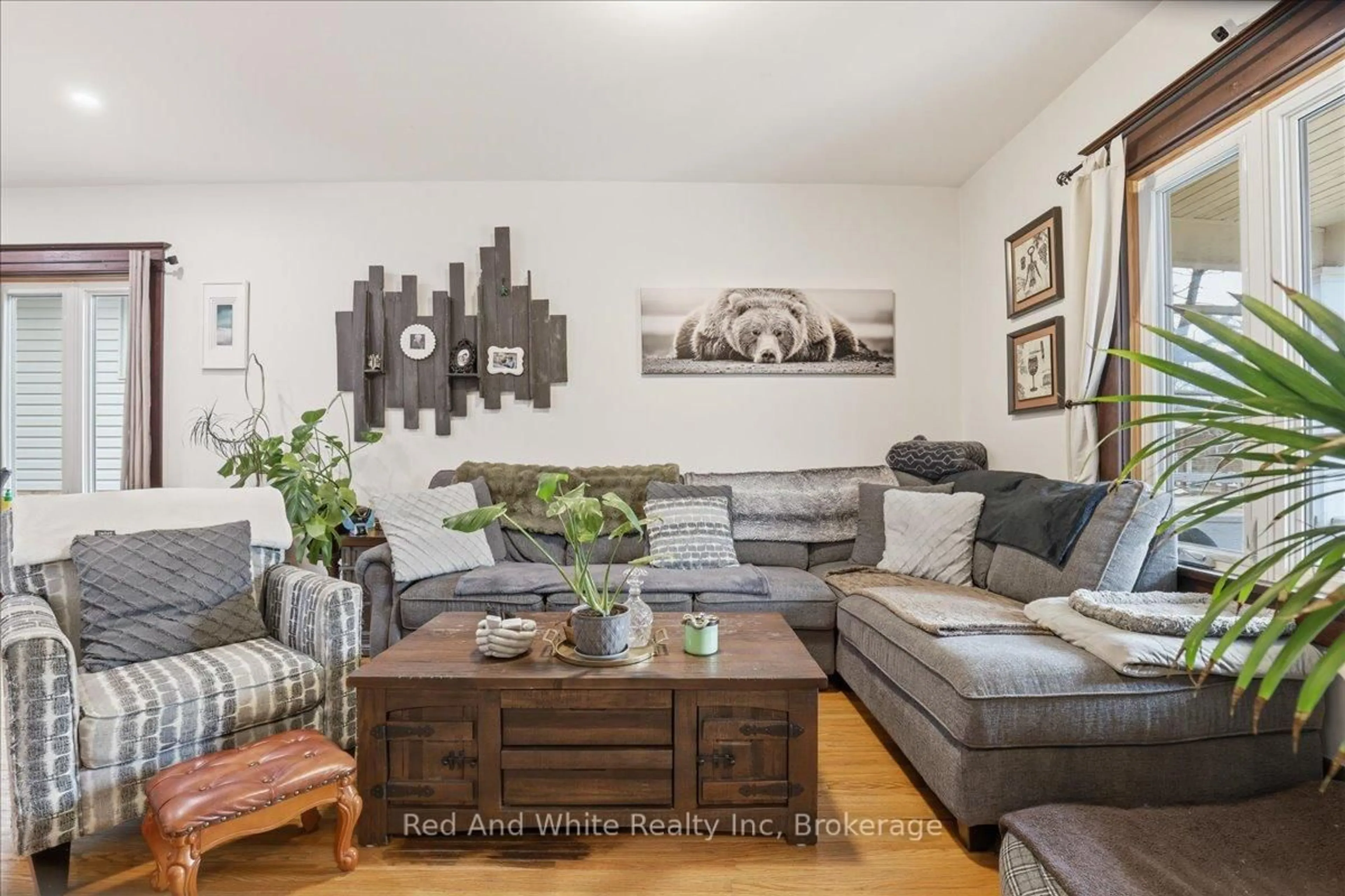 Living room with furniture, wood/laminate floor for 608 Ontario St, Stratford Ontario N5A 3J5