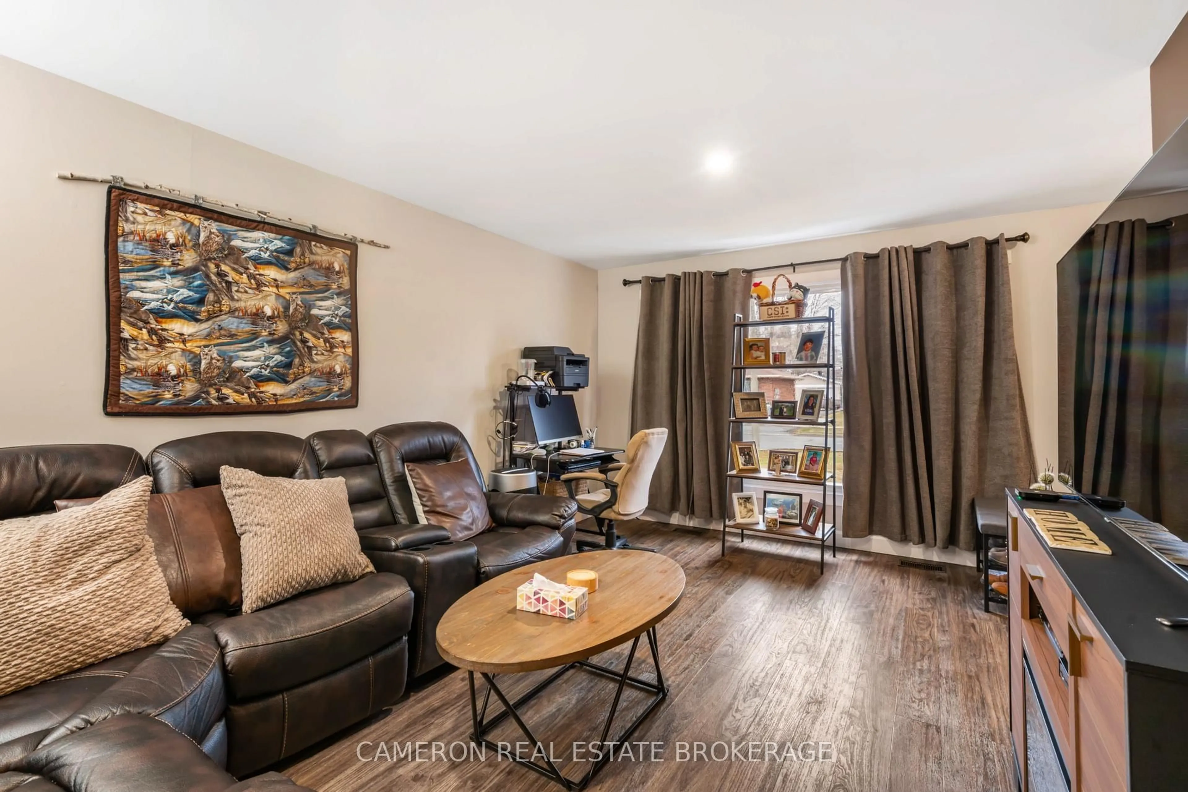 Living room with furniture, wood/laminate floor for 663 Hamilton Cres, Cornwall Ontario K6H 5N6