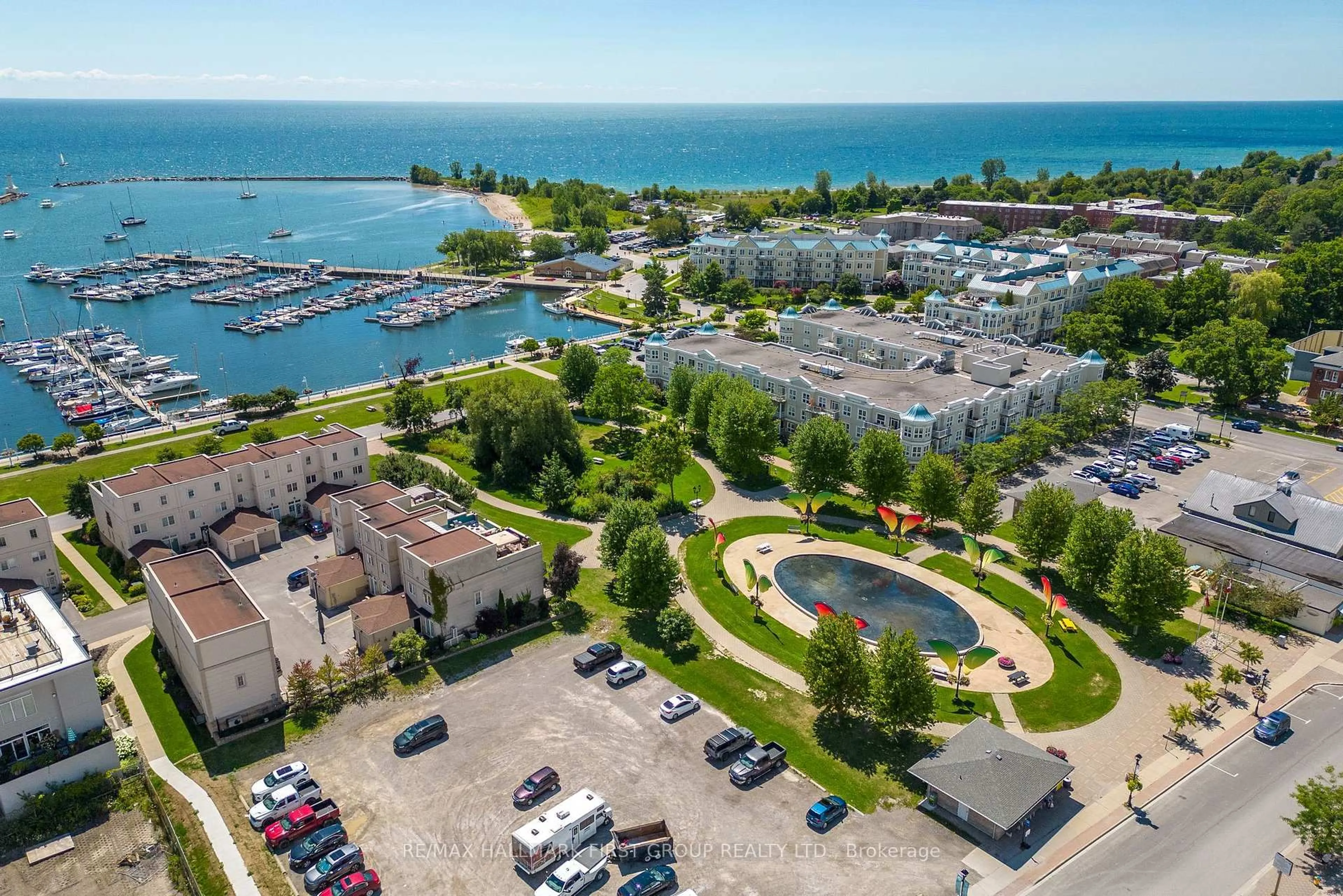 A pic from outside/outdoor area/front of a property/back of a property/a pic from drone, water/lake/river/ocean view for 145 Third St #214, Cobourg Ontario K9A 5X1