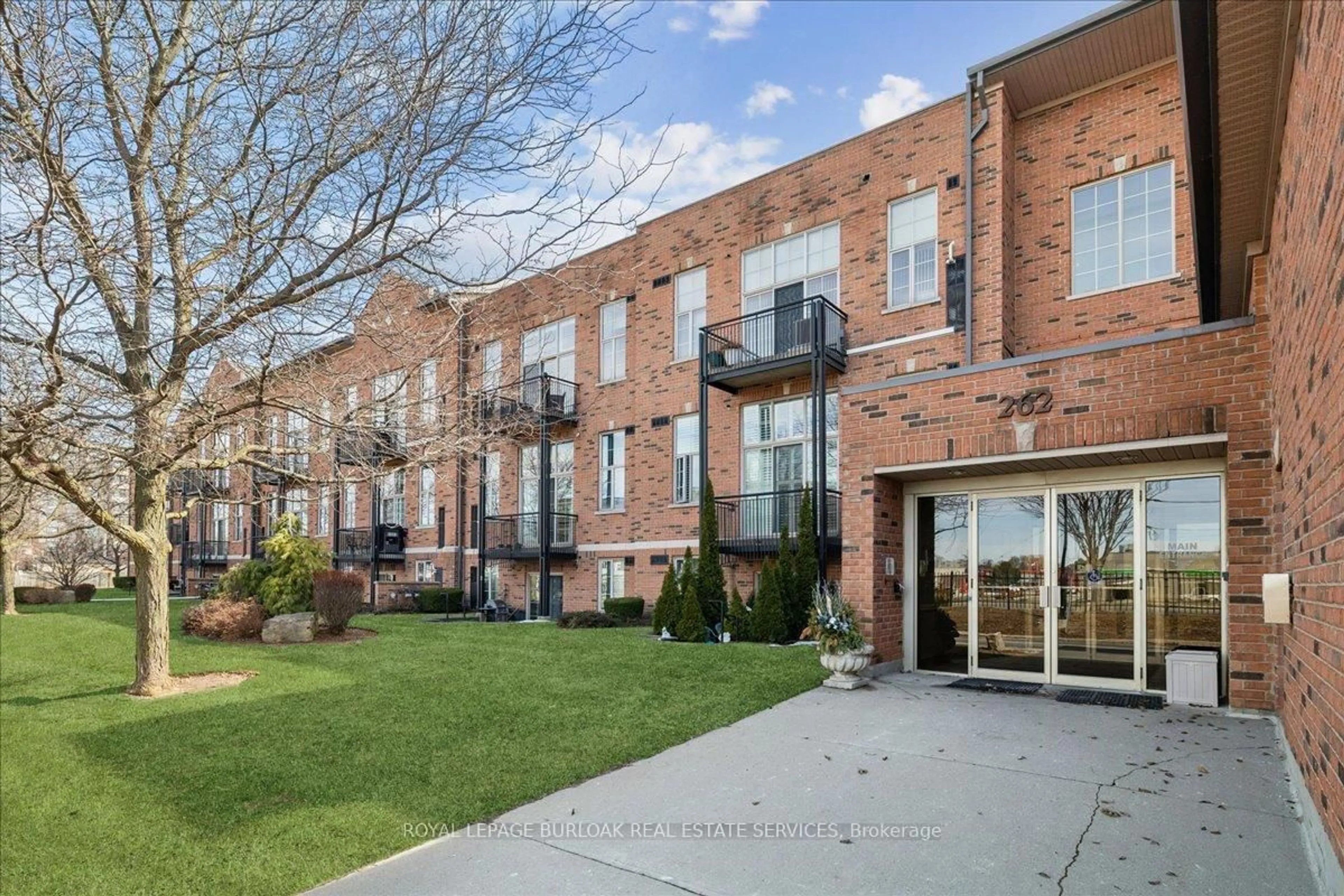 Home with brick exterior material, street for 262 Dundas St #108, Hamilton Ontario L8B 1A9