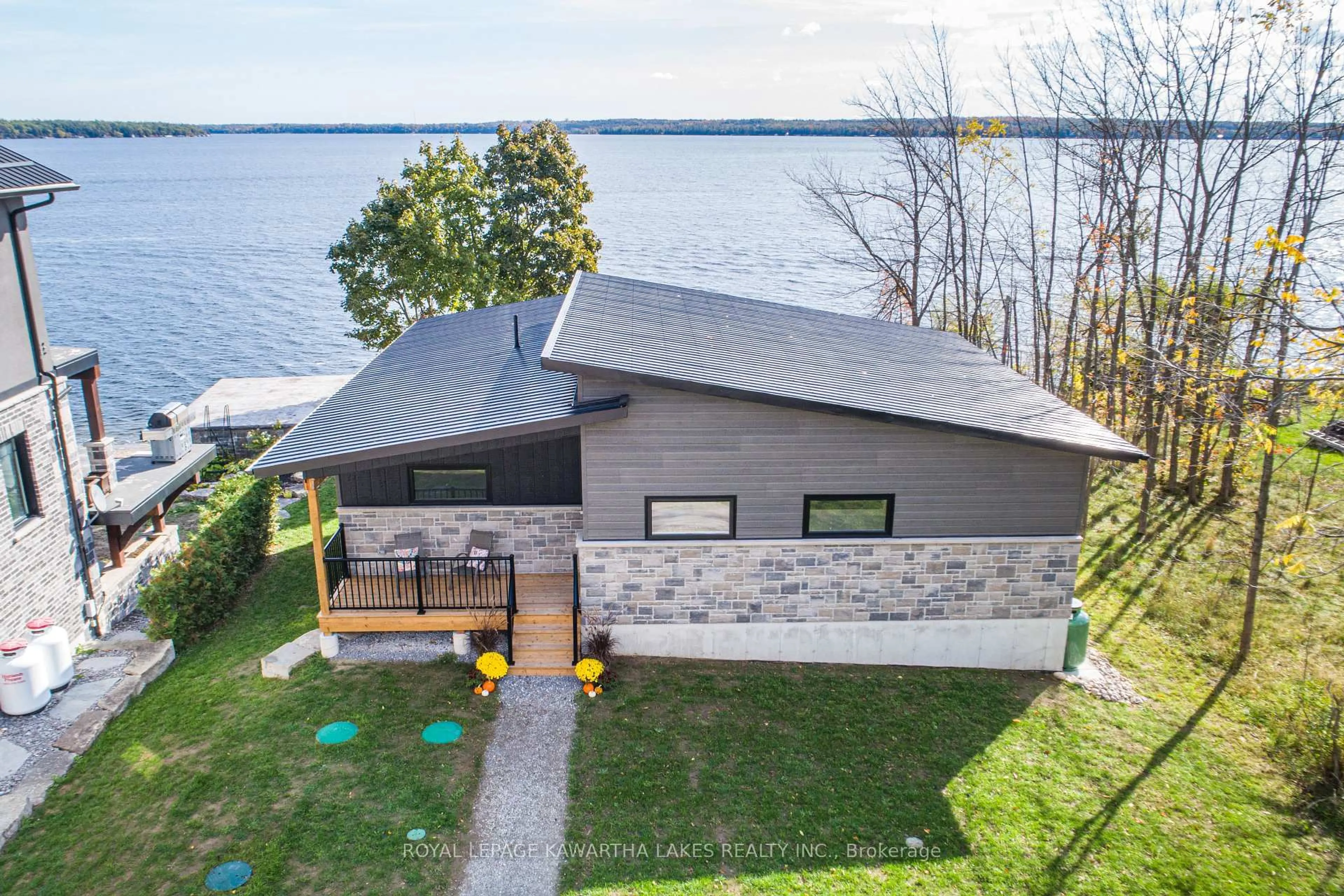 A pic from outside/outdoor area/front of a property/back of a property/a pic from drone, water/lake/river/ocean view for 532 Long Beach Rd, Kawartha Lakes Ontario K0M 1G0