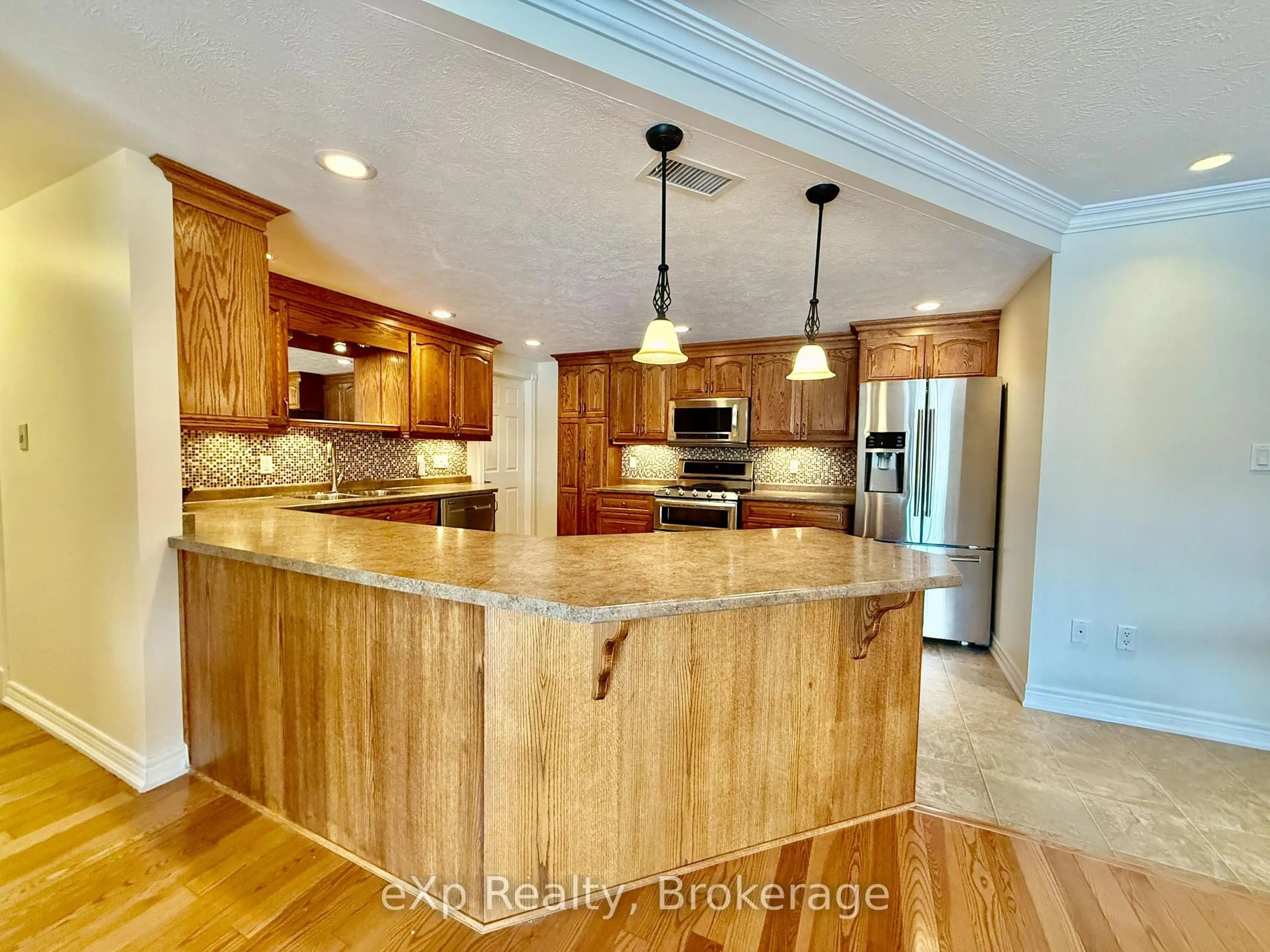 Open concept kitchen, wood/laminate floor for 125 William St #203, Brockton Ontario N0G 2V0