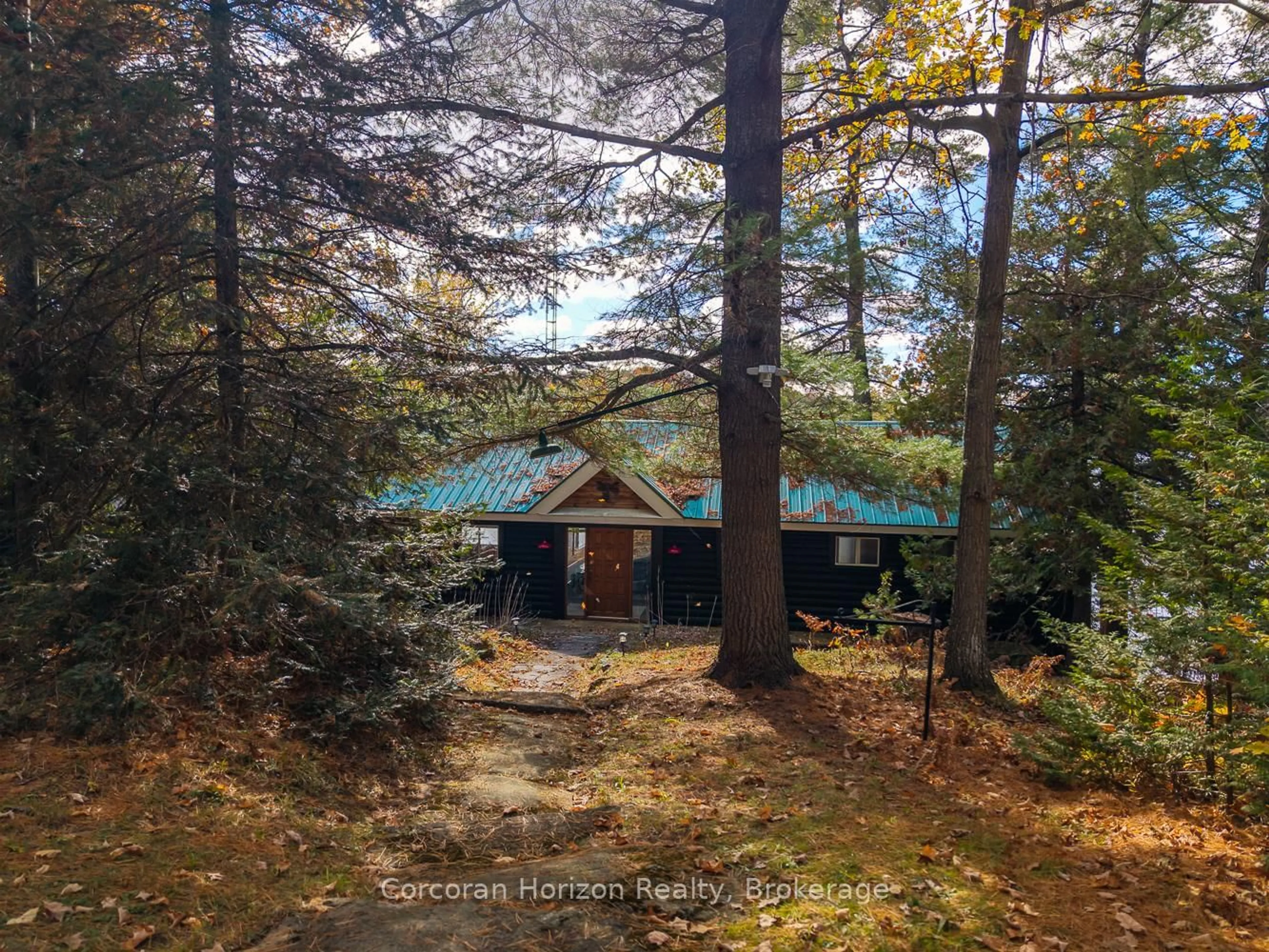 A pic from outside/outdoor area/front of a property/back of a property/a pic from drone, forest/trees view for 26 Sharon Park Dr, McKellar Ontario P0G 1C0