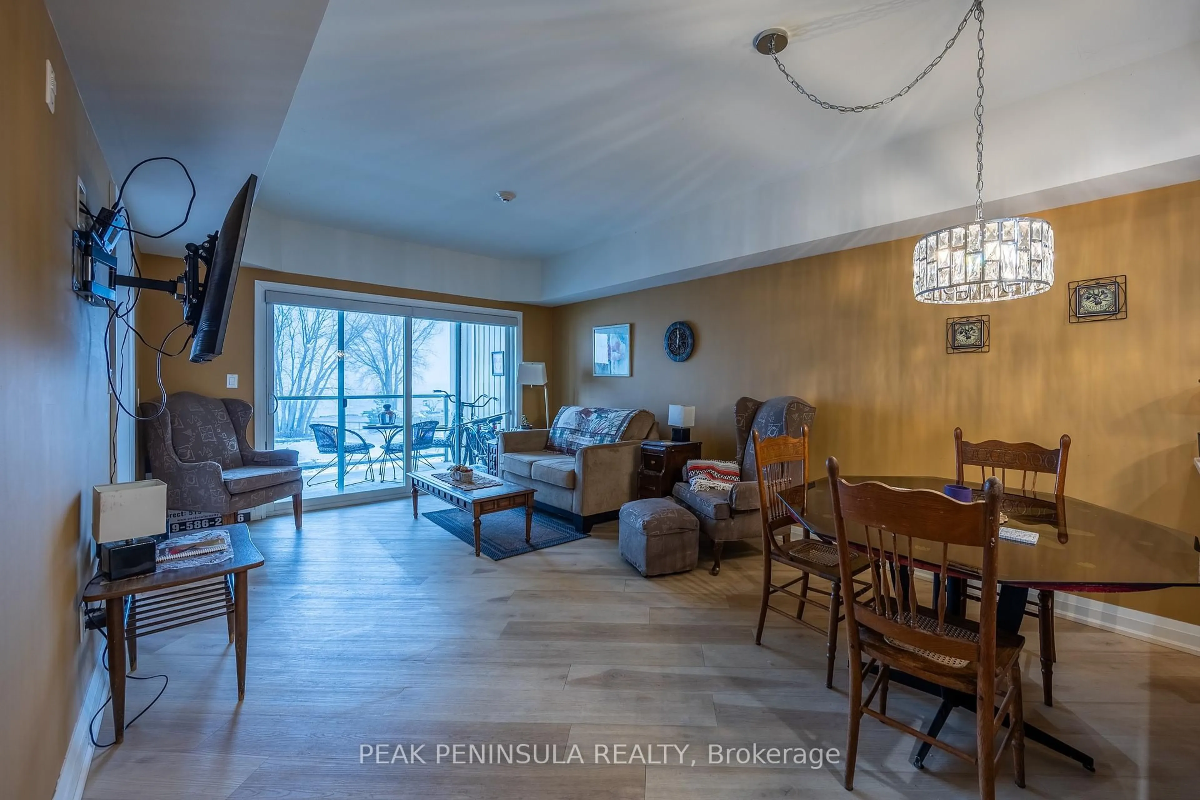 Living room with furniture, wood/laminate floor for 12 Erie Blvd #203, Norfolk Ontario N0E 1M0