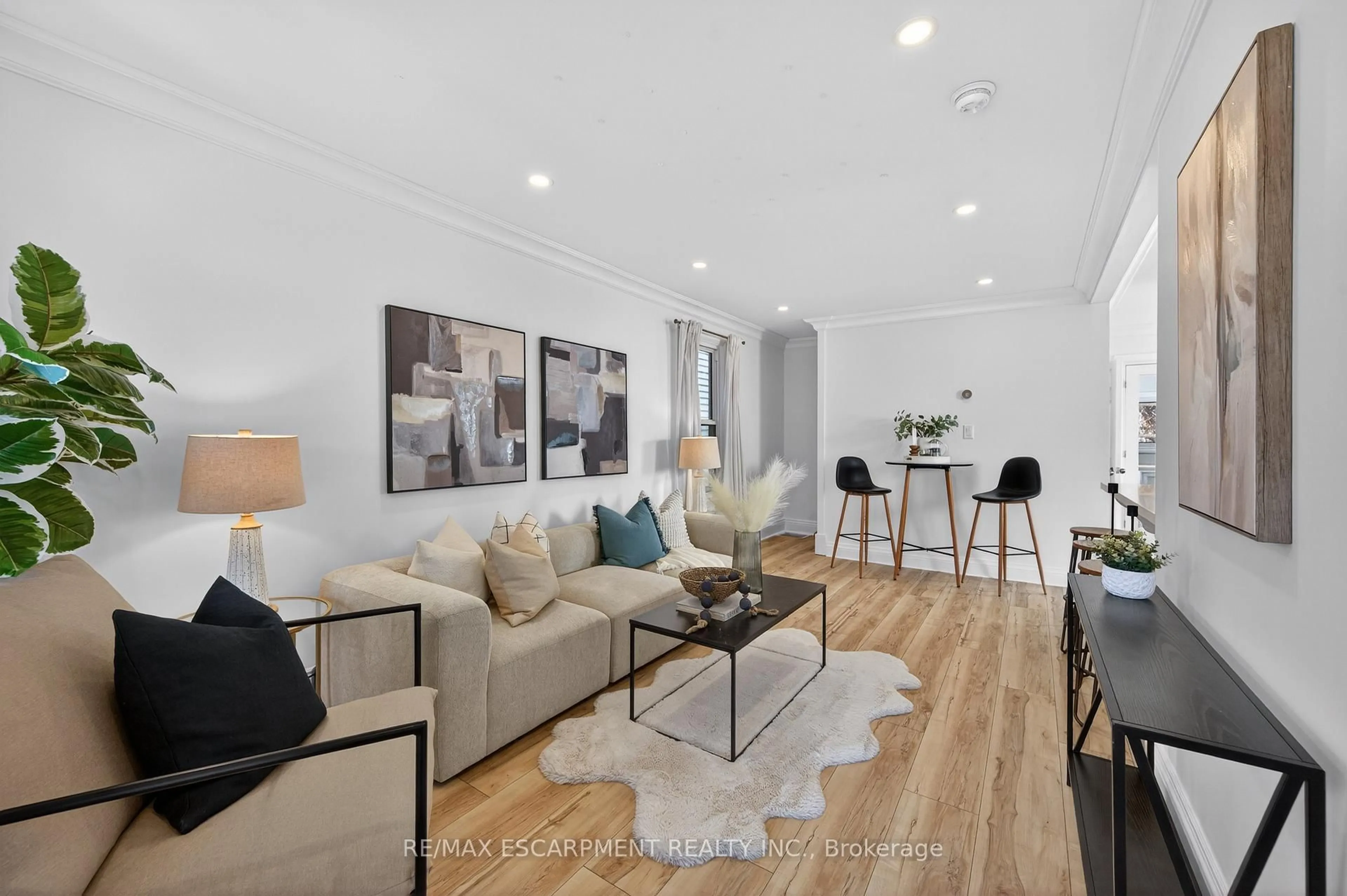 Living room with furniture, wood/laminate floor for 8 East 23rd St, Hamilton Ontario L8V 2W6