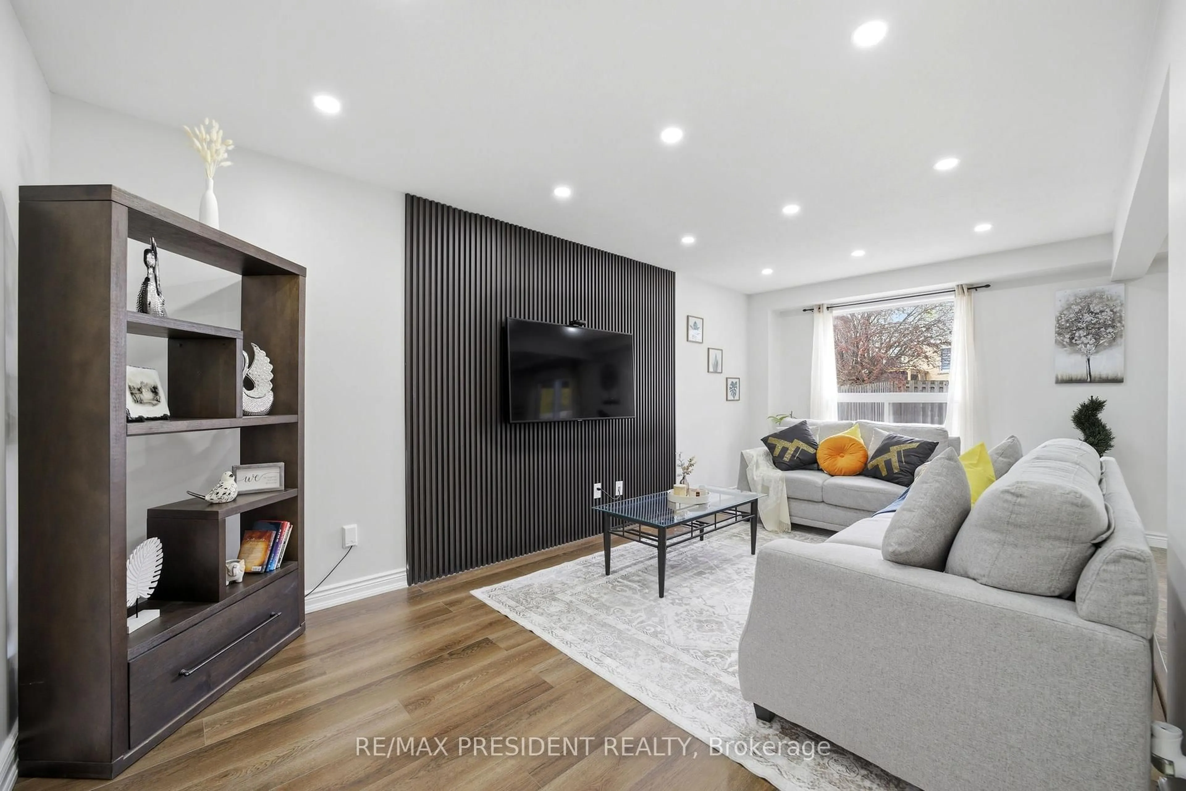 Living room with furniture, wood/laminate floor for 199 BUSH CLOVER Cres, Kitchener Ontario N2E 3P7