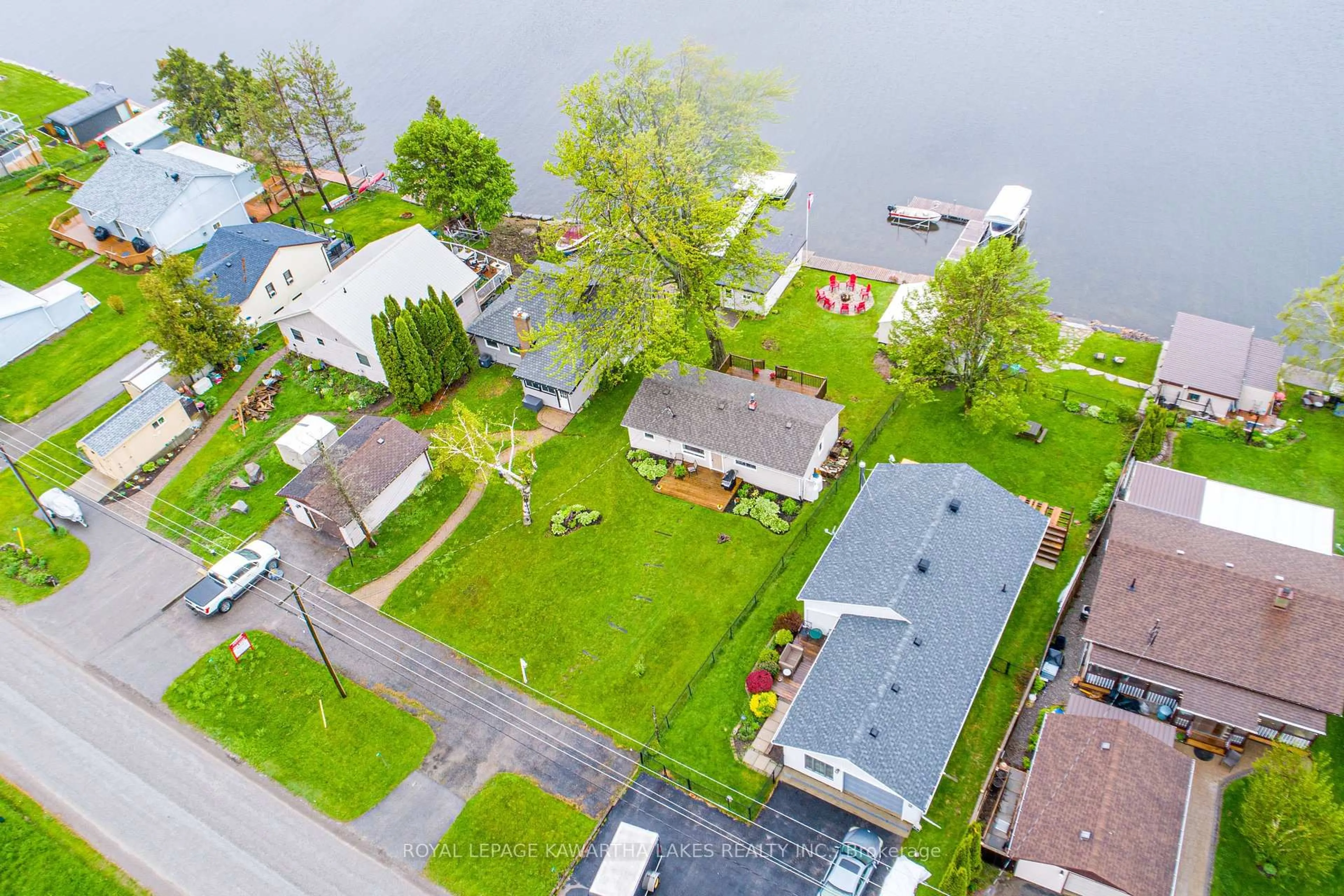 A pic from outside/outdoor area/front of a property/back of a property/a pic from drone, water/lake/river/ocean view for 215 Snug Harbour Rd, Kawartha Lakes Ontario K9V 4R6