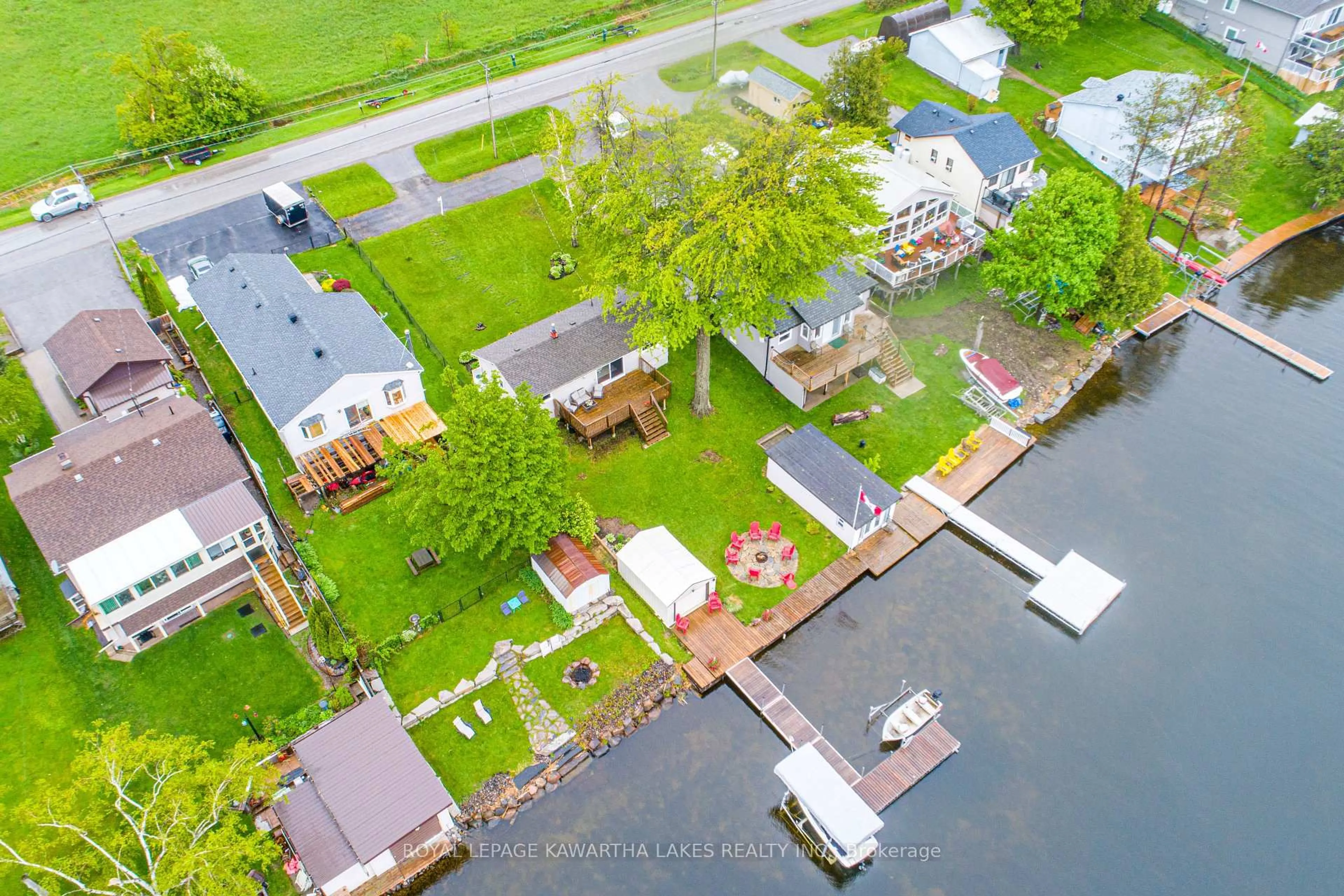 A pic from outside/outdoor area/front of a property/back of a property/a pic from drone, water/lake/river/ocean view for 215 Snug Harbour Rd, Kawartha Lakes Ontario K9V 4R6