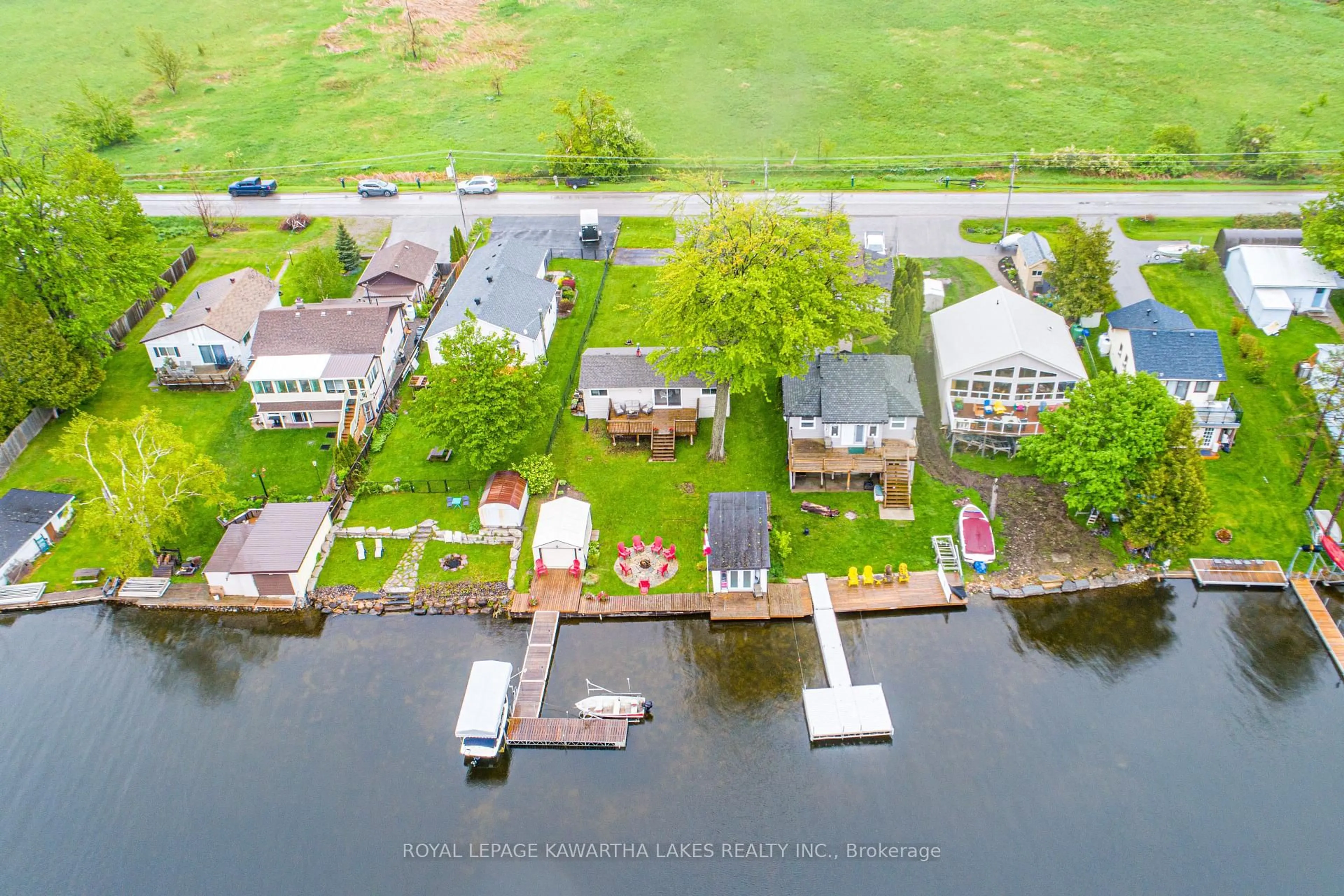 A pic from outside/outdoor area/front of a property/back of a property/a pic from drone, water/lake/river/ocean view for 215 Snug Harbour Rd, Kawartha Lakes Ontario K9V 4R6