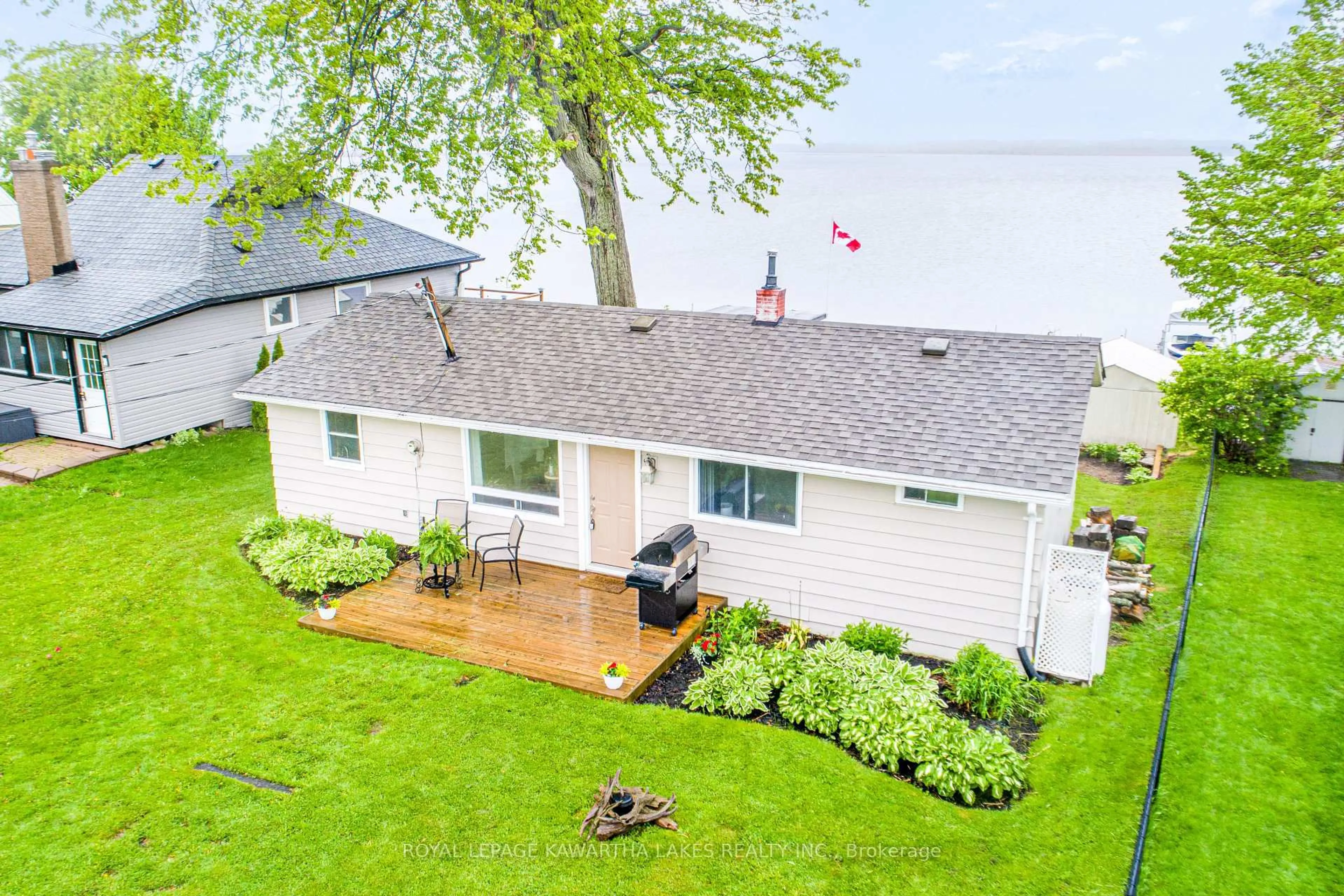 A pic from outside/outdoor area/front of a property/back of a property/a pic from drone, water/lake/river/ocean view for 215 Snug Harbour Rd, Kawartha Lakes Ontario K9V 4R6