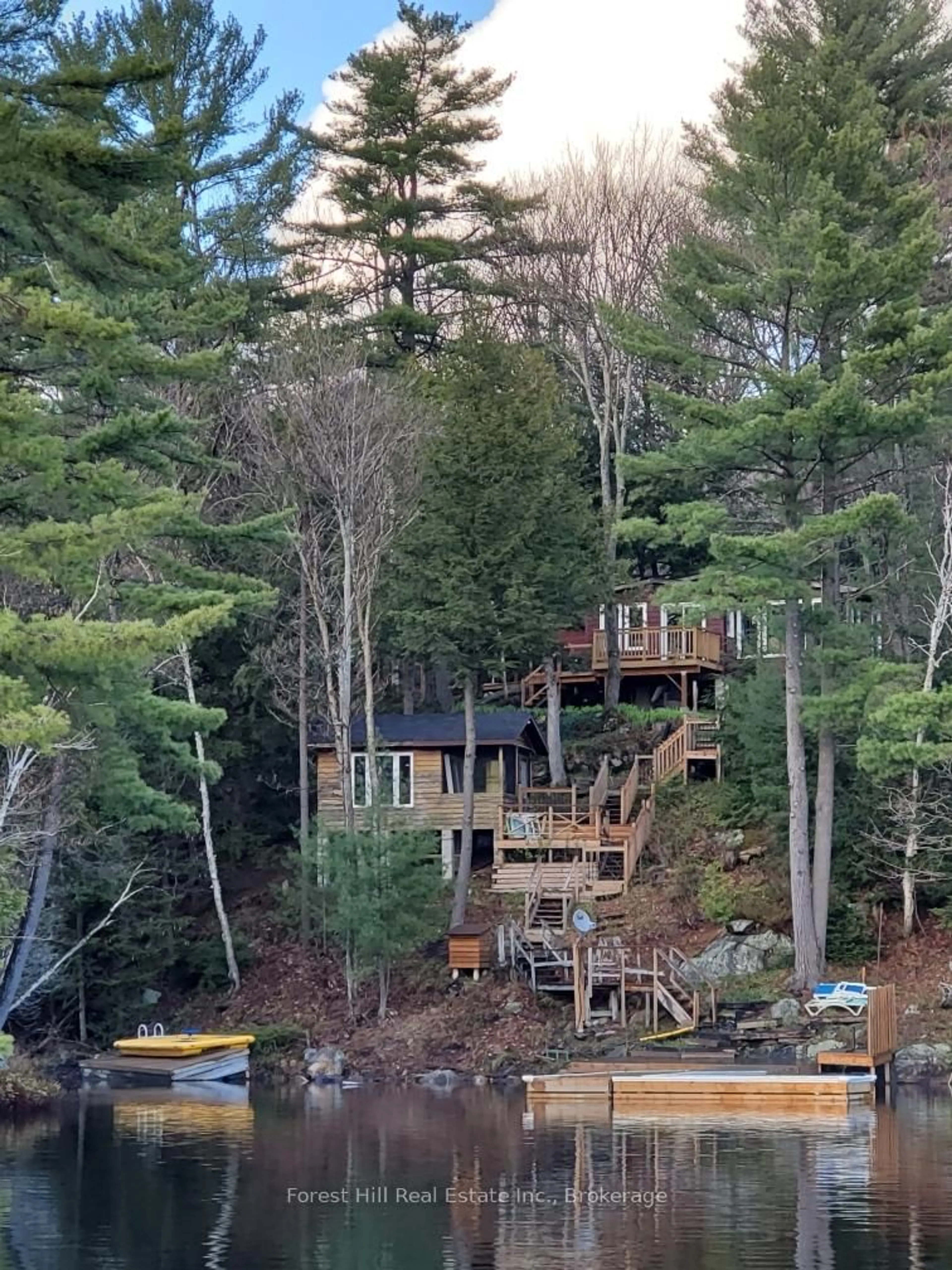 A pic from outside/outdoor area/front of a property/back of a property/a pic from drone, forest/trees view for 7 BEAR Lane, Seguin Ontario P2A 2W8