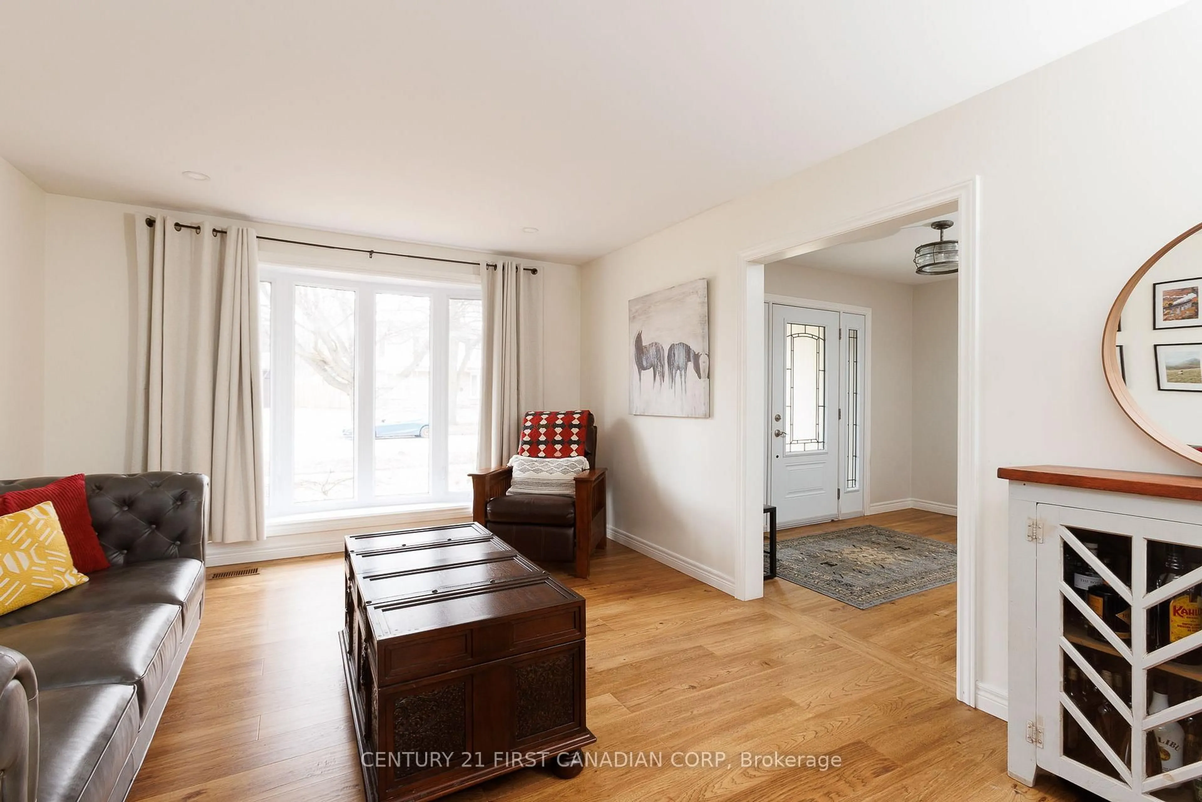 Living room with furniture, wood/laminate floor for 737 Village Green Ave, London South Ontario N6K 1H3