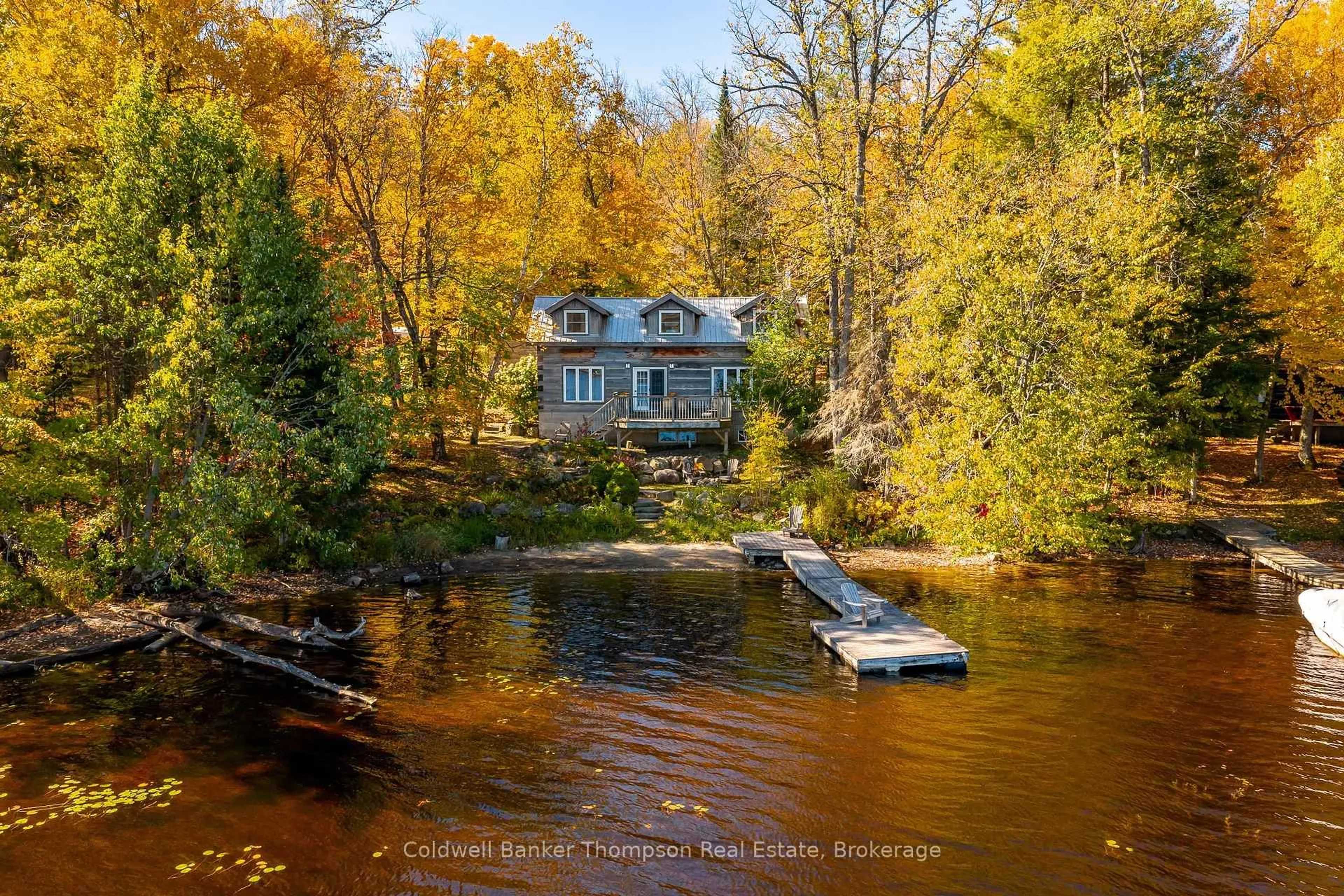 A pic from outside/outdoor area/front of a property/back of a property/a pic from drone, water/lake/river/ocean view for 18 Port Vernon Lane, Huntsville Ontario P1H 2J2