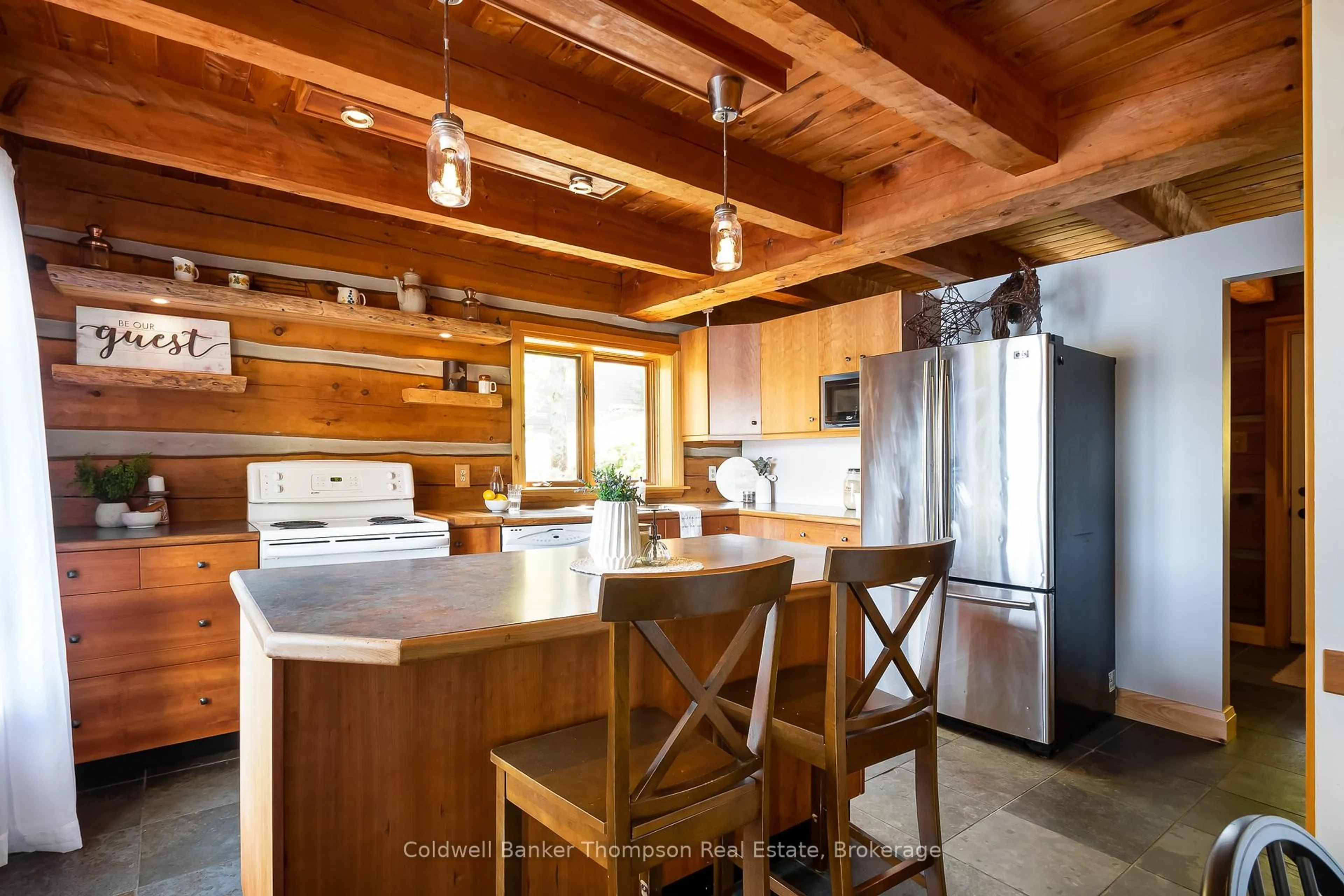 Open concept kitchen, wood/laminate floor for 18 Port Vernon Lane, Huntsville Ontario P1H 2J2