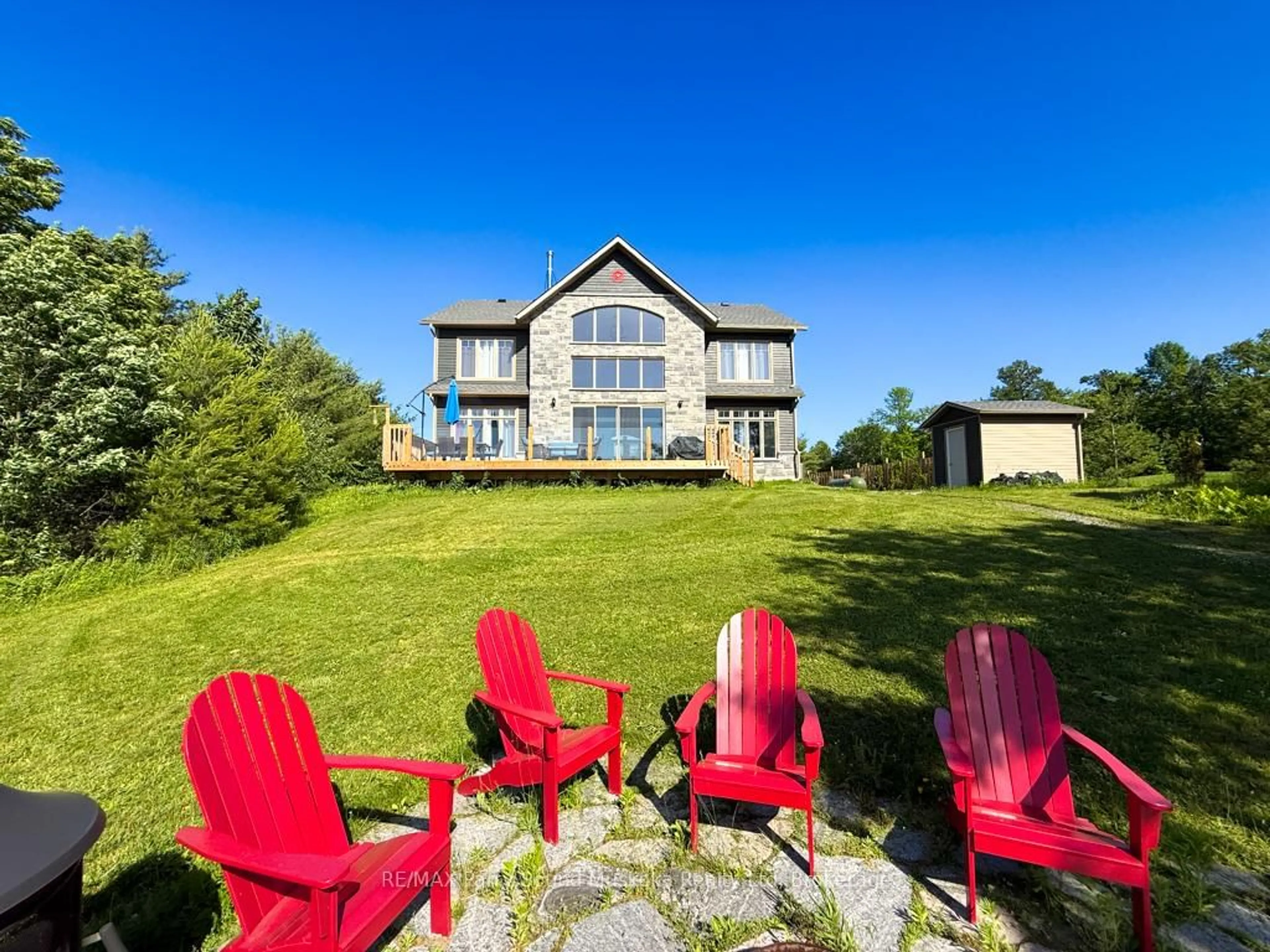 A pic from outside/outdoor area/front of a property/back of a property/a pic from drone, water/lake/river/ocean view for 730 124 Highway, McKellar Ontario P0G 1C0