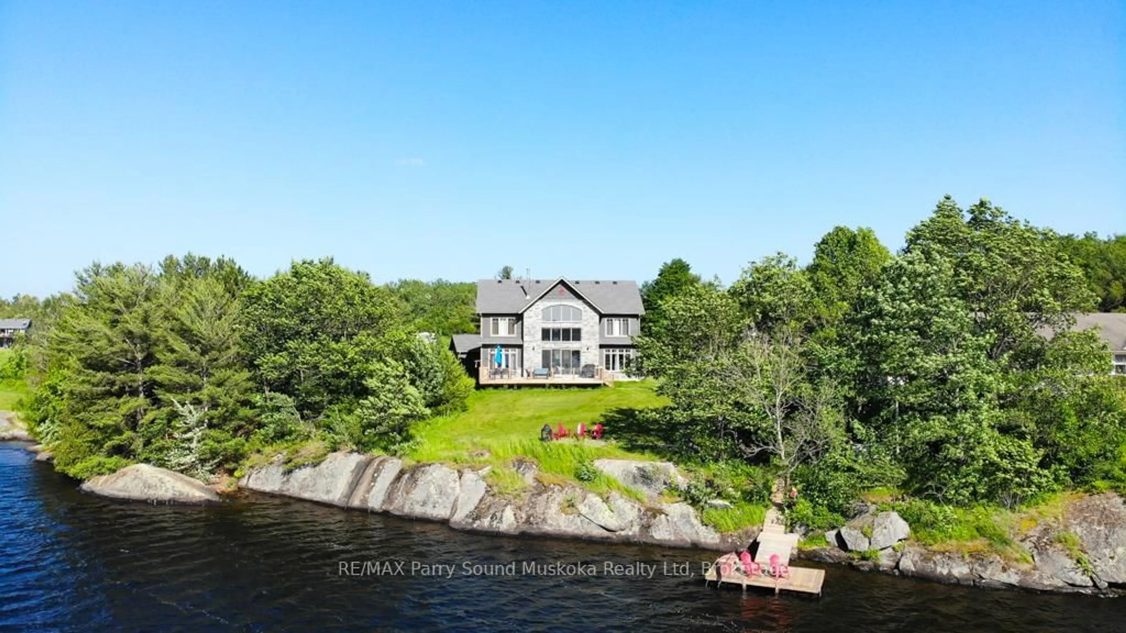 A pic from outside/outdoor area/front of a property/back of a property/a pic from drone, water/lake/river/ocean view for 730 124 Highway, McKellar Ontario P0G 1C0