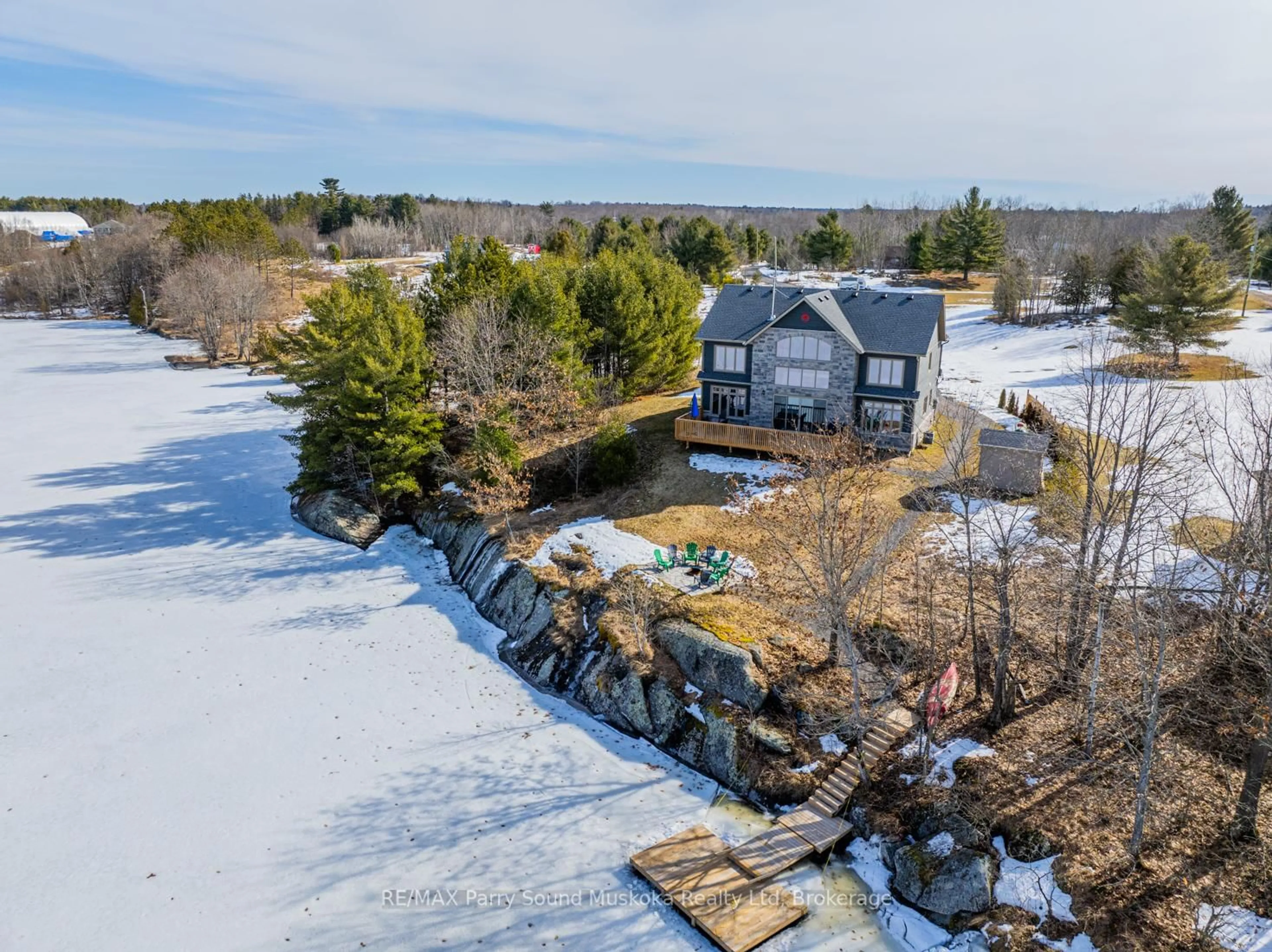 A pic from outside/outdoor area/front of a property/back of a property/a pic from drone, water/lake/river/ocean view for 730 124 Highway, McKellar Ontario P0G 1C0