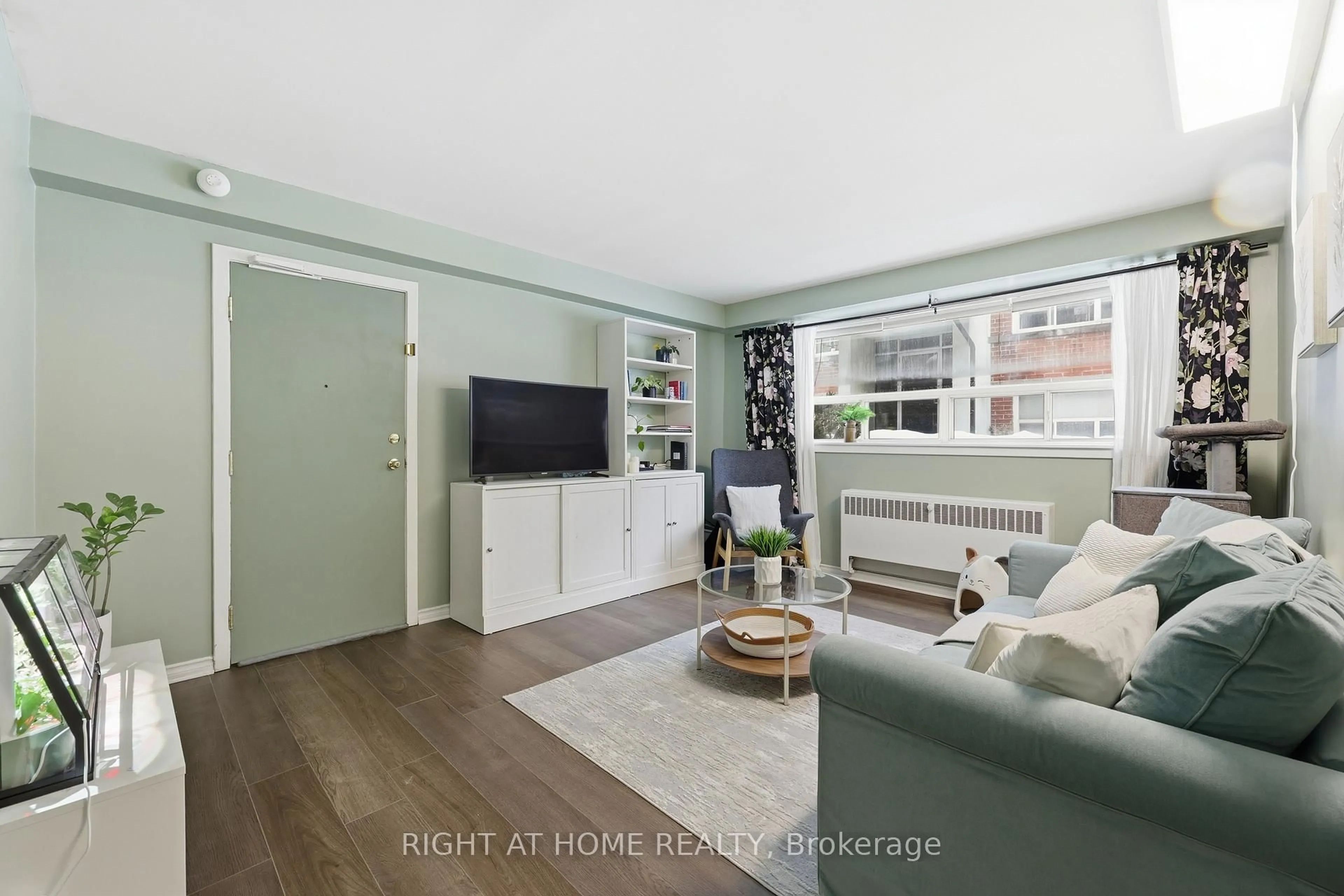 Living room with furniture, wood/laminate floor for 223 MacNab St #11, Hamilton Ontario L8P 3C9