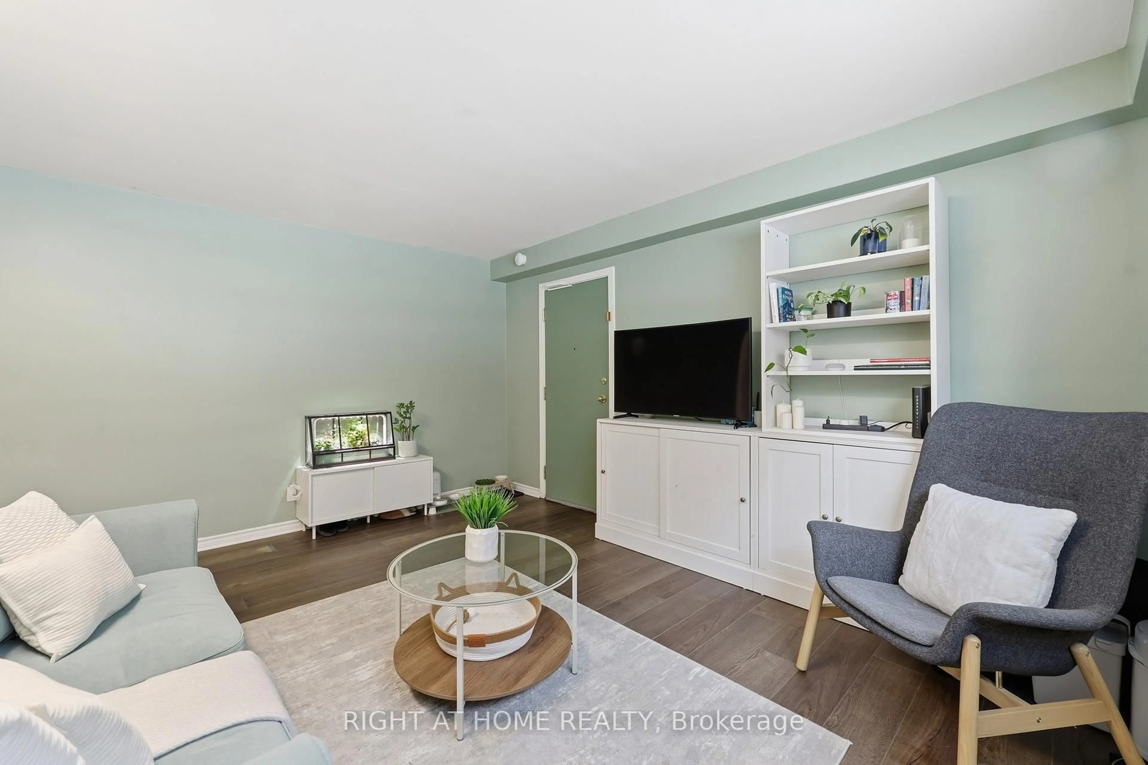 Living room with furniture, wood/laminate floor for 223 MacNab St #11, Hamilton Ontario L8P 3C9