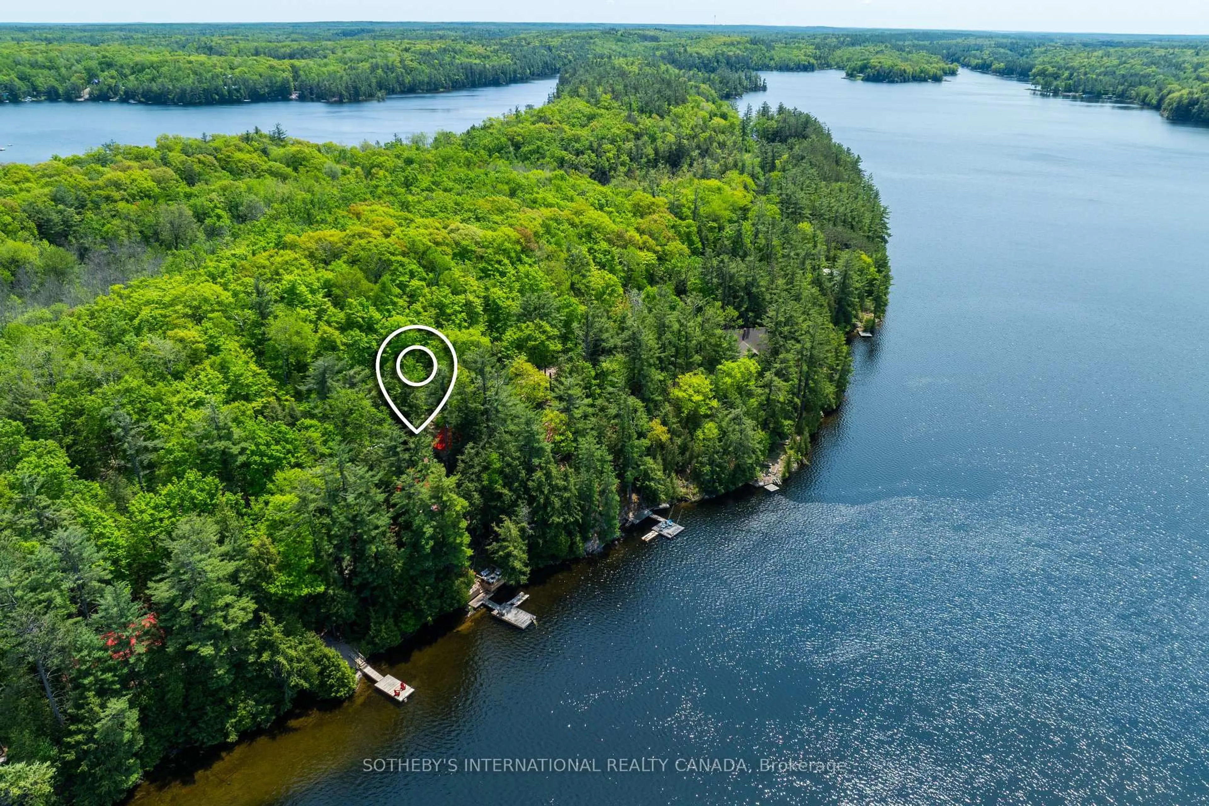 A pic from outside/outdoor area/front of a property/back of a property/a pic from drone, water/lake/river/ocean view for 1030 Cobble Rose Lane, Minden Hills Ontario K0M 2L1